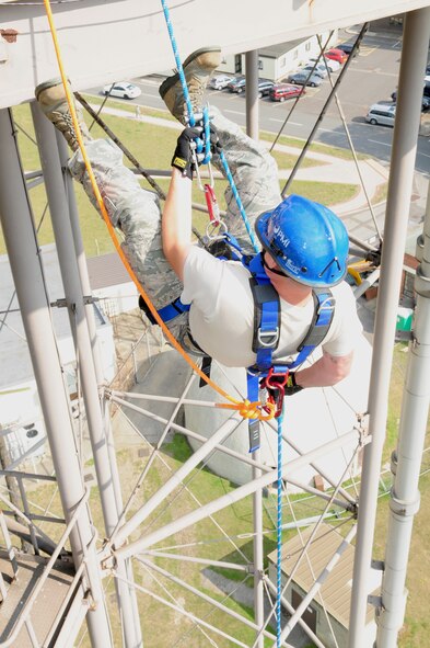 U.S. Air Force Staff Sgt. Jeffrey Ivey, 100th Civil Engineer Squadron Fire Department firefighter from Irving, Texas, rappels from the top of a water tower, 120-feet above the ground, during a technical rope rescue training session Sept. 4, 2013, on RAF Mildenhall, England. Firefighters here received training from instructors from the 435th Construction and Training Squadron, Ramstein Air Base, Germany, on a variety of rescue techniques and scenarios including operational risk management, incident management system, ground support for helicopter operations and confined space rescue. This training is vital to keep first responders proficient in procedures, in the event that a rescue requires such skills. (U.S. Air Force photo by Karen Abeyasekere/Released)