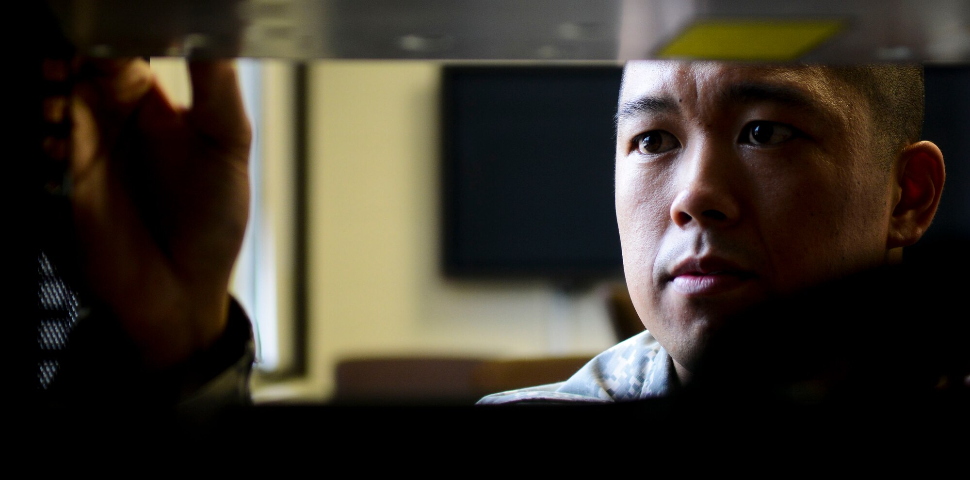 U.S. Army Staff Sgt. Frank Tungpalan, 93rd Signal Bde. information systems operator, troubleshoots a server at Fort Eustis, Va., Aug. 2, 2013. Tungpalan believes self-motivation can make a positive Army career possible. (U.S. Air Force photo by Airman 1st Class Austin Harvill/Released)