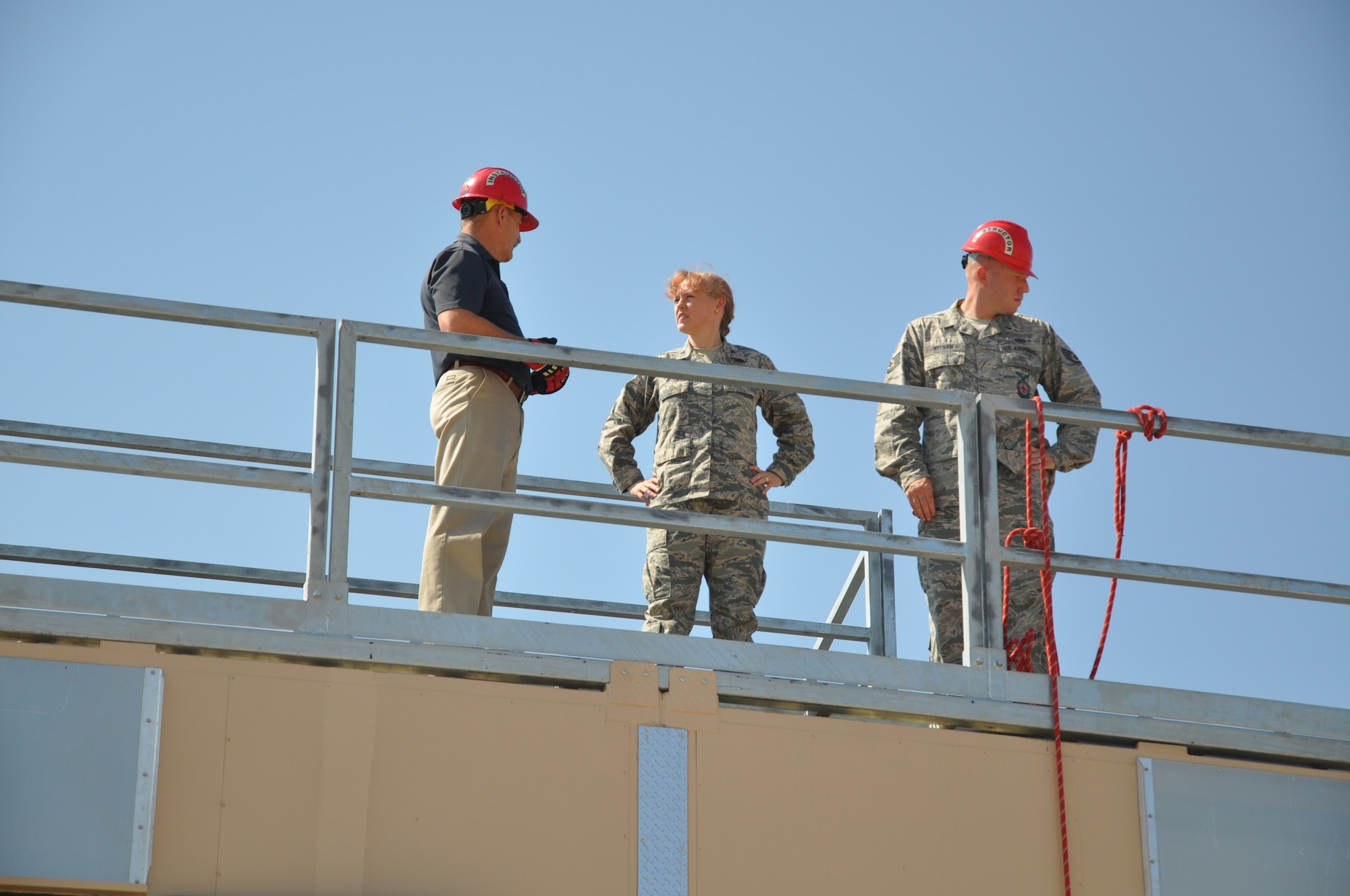 GOODFELLOW AIR FORCE BASE, Texas- James Carey, 312th Training Squadron instructor supervisor, gives a tour of the newest structural fire trainer at the Defense Department Louis F. Garland Fire Academy to Col. Kimberlee Joos, 17th Training Wing Commander Aug. 30. Joos took a tour of the trainer after the trainer’s dedication ceremony. (U.S. Air Force photo/ Airman 1st Class Erica Rodriguez)