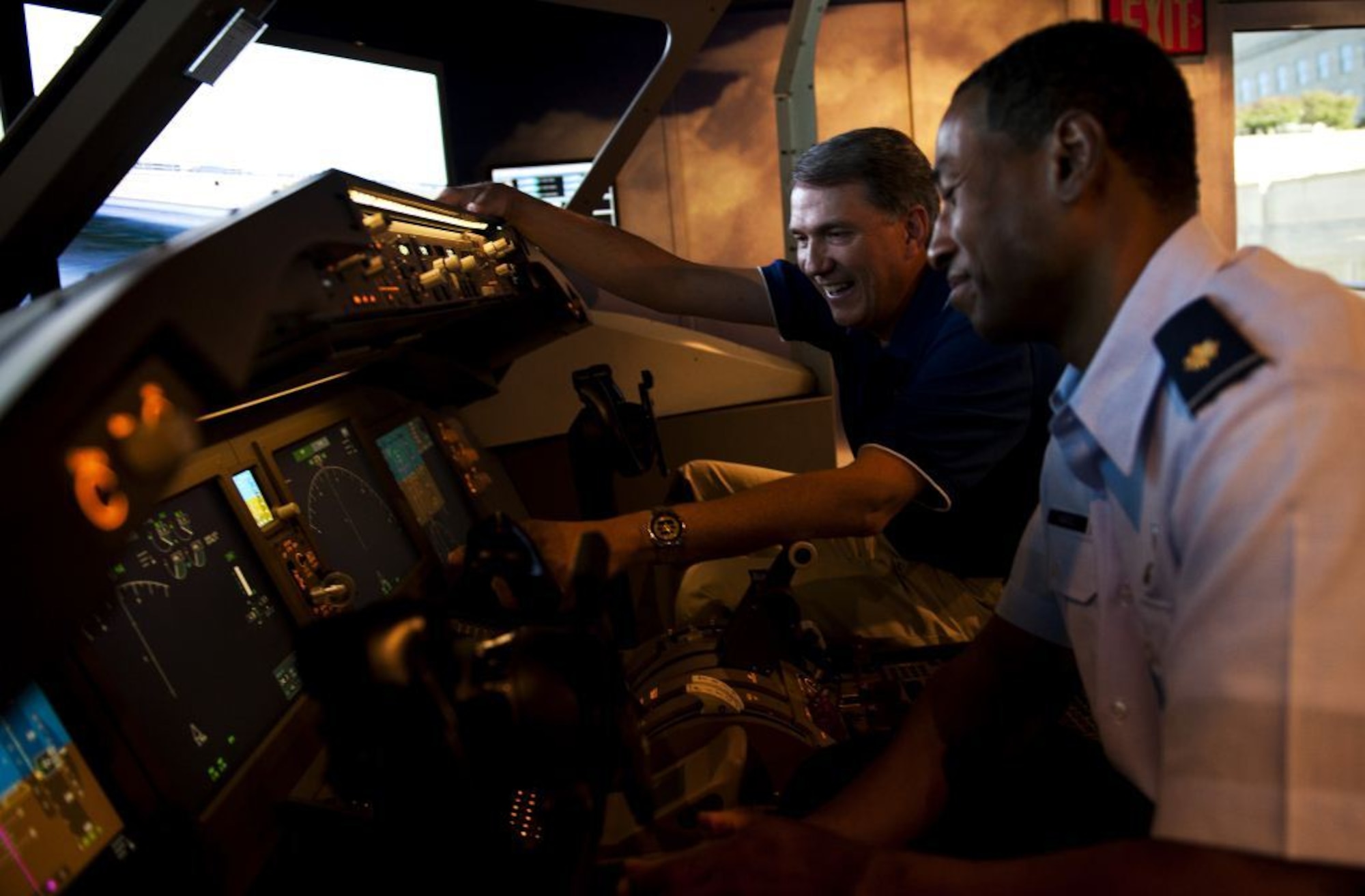 From right, Maj. Damen Forte, who's been aircrew on the KC-135 Stratotanker and the C-17 Globemaster III, is at the controls to the Air Force's newest tanker, the KC-46, with Greg Bulkley, chief technical pilot for Boeing's KC-46. (U.S. Air Force photo/Staff Sgt. David Salanitri)
