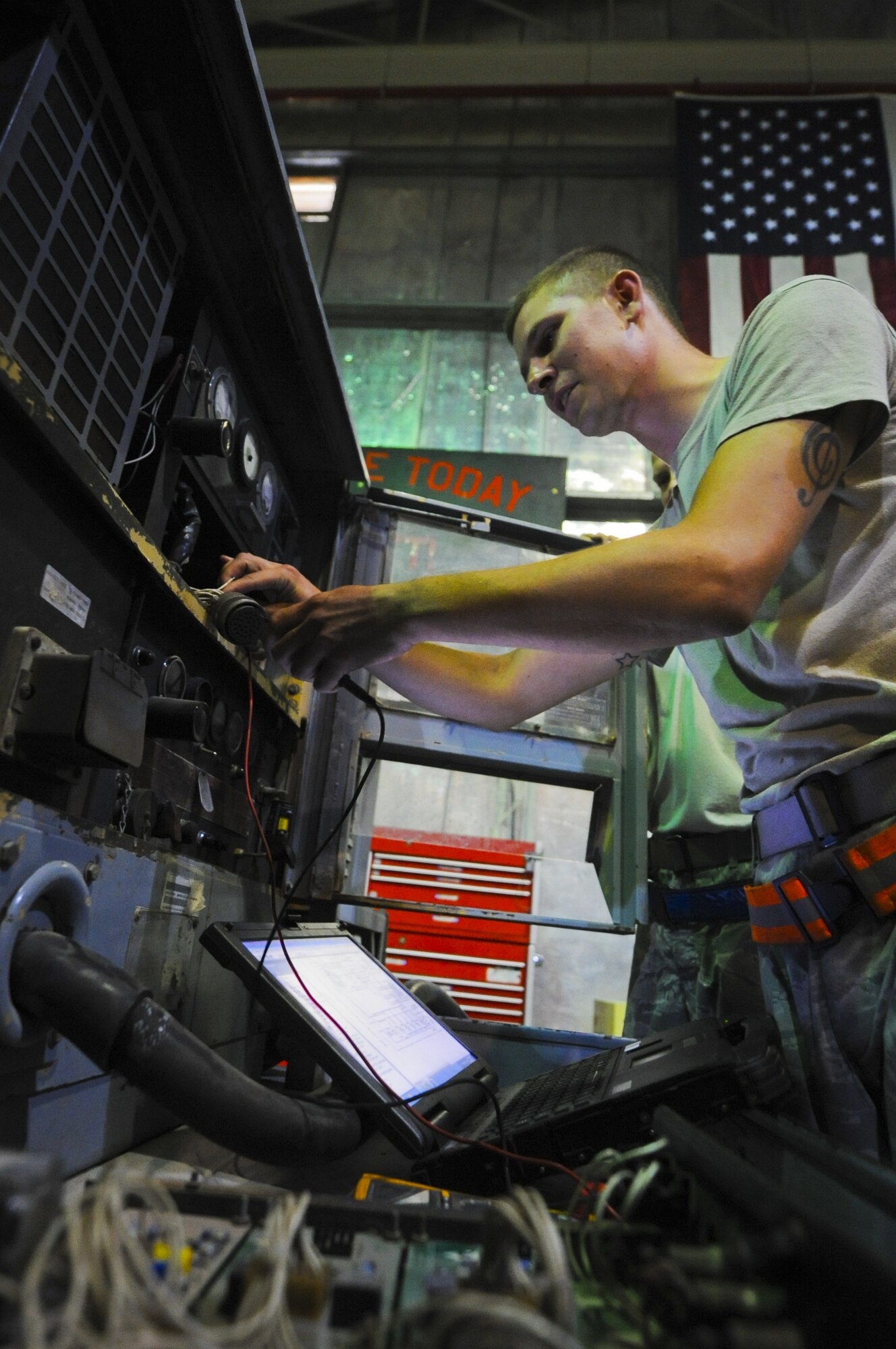 U.S. Air Force Staff Sgt. Kyle Anderson, 380th Expeditonary Maintenance Squadron aerospace ground equipment craftsman, tests wires on a generator used on the flightline at an undisclosed location in Southwest Asia Sept. 2, 2013. The generator is used to provide power to aircraft on the ground while maintenance personnel test systems and works on the plane. Anderson calls Crystal Lake, Ill., home and is deployed from Tinker Air Force Base, Okla. (U.S. Air Force photo by Staff Sgt. Jacob Morgan) 