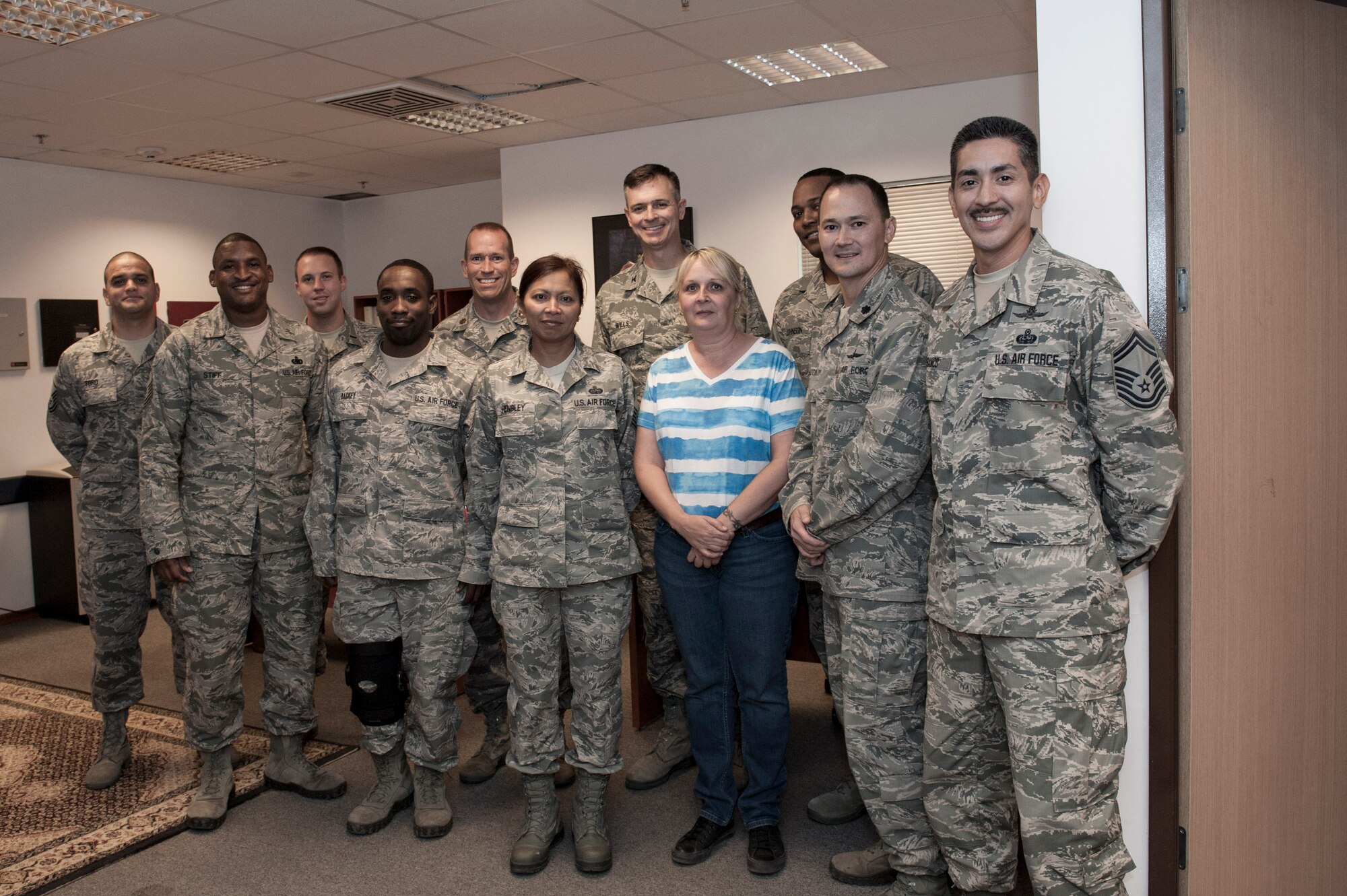 Jaqui Haykir, 39th Communications Squadron maintenance operation technician, poses for a group photo with Airmen assigned to the 39th CS, after being recognized for her outstanding work Sept. 5, 2013, at Incirlik Air Base, Turkey. "Pick of the 'Lik" recognizes outstanding members of Team Incirlik who display a commitment to excellence. Airmen are nominated by their squadron supervision and selected by 39th Air Base WIng senior leadership for recognition. (U.S. Air Force photo by Airman 1st Class Nicole Sikorski/Released)

