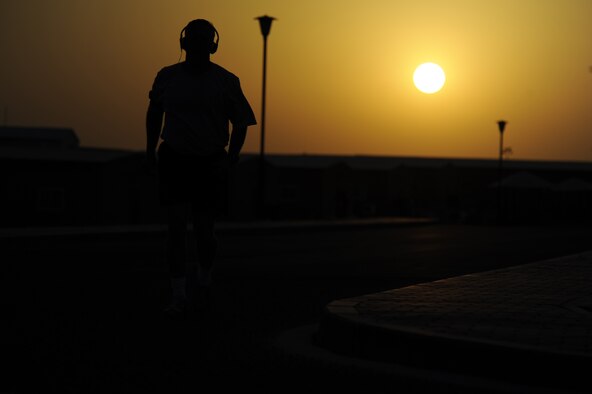 Master Sgt. Christopher Campbell, 386th Air Expeditionary Wing,
photojournalist, completes one of his runs while the sun rises in the
background here, Aug. 28, 2013. Campbell runs every day he can and he
averages between 4.5 to 8 miles each run.  Campbell, a native of Phoenix, is
deployed out of the 355th Fighter Wing, Davis-Monthan Air Force Base, Ariz.
(U.S. Air Force photo by Master Sgt. Christopher A. Campbell)