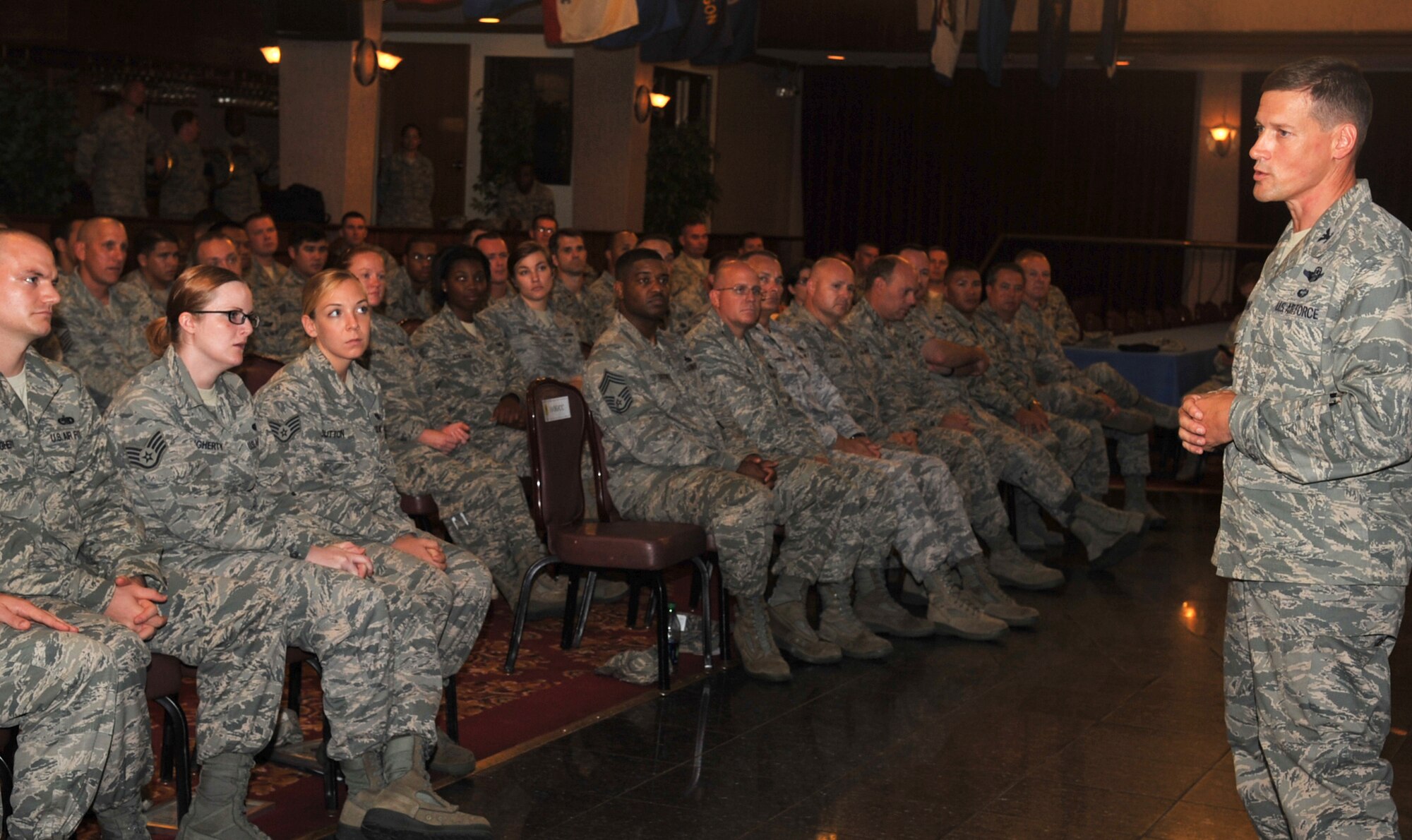 U.S. Air Force Col. Peter Milohnic, 18th Operations Group commander, speaks to newly promoted staff sergeants during a quarterly NCO induction ceremony at the Rocker NCO Club on Kadena Air Base, Japan, Sept. 4, 2013. Milohnic explained the importance and responsibilities of the NCO. (U.S. Air Force photo by Naoto Anazawa)