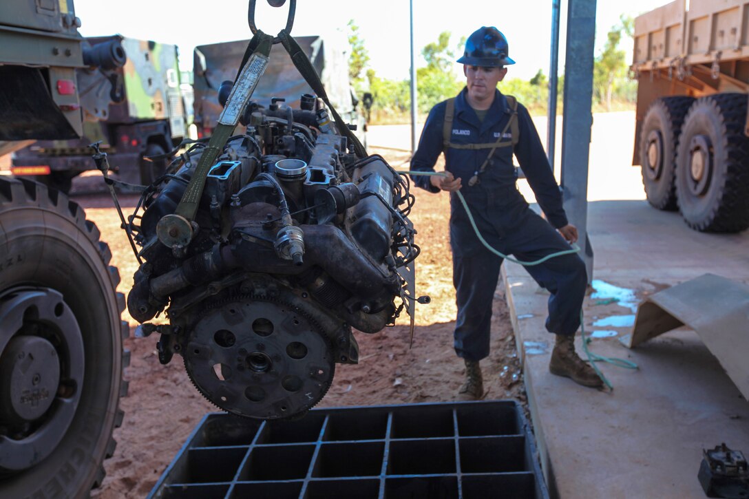 U.S. Marine Corps Cpl. Jose L. Polanco steadies a high-mobility, multi-purpose wheeled vehicle’s engine on a wench during Exercise Koolendong 13 on Bradshaw Field Training Area, Australia, Sept. 1, 2013. Polanco, a heavy equipment mechanic, is assigned to Combat Logistics Battalion 31, 31st Marine Expeditionary Unit.