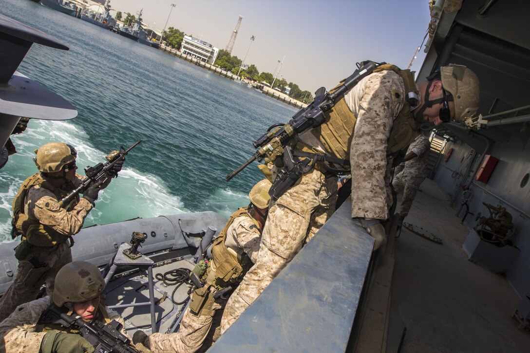 U.S. Marines assigned to Force Reconnaissance Platoon, Maritime Raid Force, 26th Marine Expeditionary Unit (MEU), board a vessel during simulated Maritime Interdiction Operations (MIO) training in the U.S. 5th Fleet area of responsibility, Aug. 28, 2013. The 26th MEU is a Marine Air-Ground Task Force forward-deployed to the U.S. 5th Fleet area of responsibility aboard the Kearsarge Amphibious Ready Group serving as a sea-based, expeditionary crisis response force capable of conducting amphibious operations across the full range of military operations. (U.S. Marine Corps photo by Sgt. Christopher Q. Stone, 26th MEU Combat Camera/Released)
 
