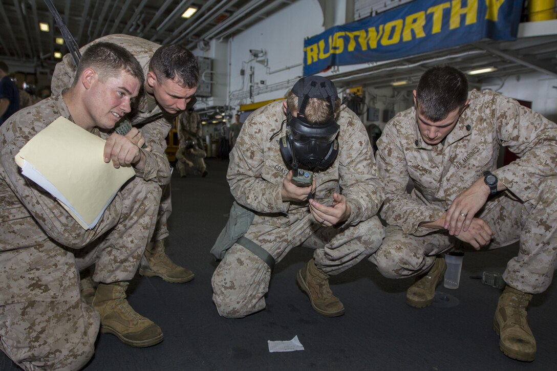 U.S. Marines with India Co., Battalion Landing Team 3/2, 26th Marine Expeditionary Unit (MEU), practice calling in a nine-line casualty evacuation request during a team leader’s course, in the hangar bay of the USS Kearsarge (LHD 3), at sea, Sept. 3, 2013. The 26th MEU is a Marine Air-Ground Task Force currently assigned to the U.S. 5th Fleet area of responsibility aboard the Kearsarge Amphibious Ready Group serving as a sea-based, expeditionary crisis response force capable of conducting amphibious operations across the full range of military operations. (U.S. Marine Corps photo by Cpl. Kyle N. Runnels/Released)