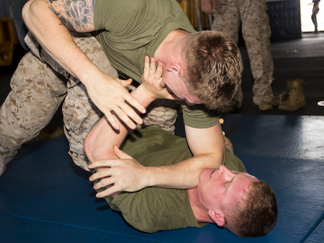 U.S. Marines with India Co., Battalion Landing Team 3/2, 26th Marine Expeditionary Unit (MEU), grapple during a team leader’s course, at sea, Sept. 3, 2013. The 26th MEU is a Marine Air-Ground Task Force currently assigned to the U.S. 5th Fleet area of responsibility aboard the Kearsarge Amphibious Ready Group serving as a sea-based, expeditionary crisis response force capable of conducting amphibious operations across the full range of military operations. (U.S. Marine Corps photo by Cpl. Kyle N. Runnels/Released)