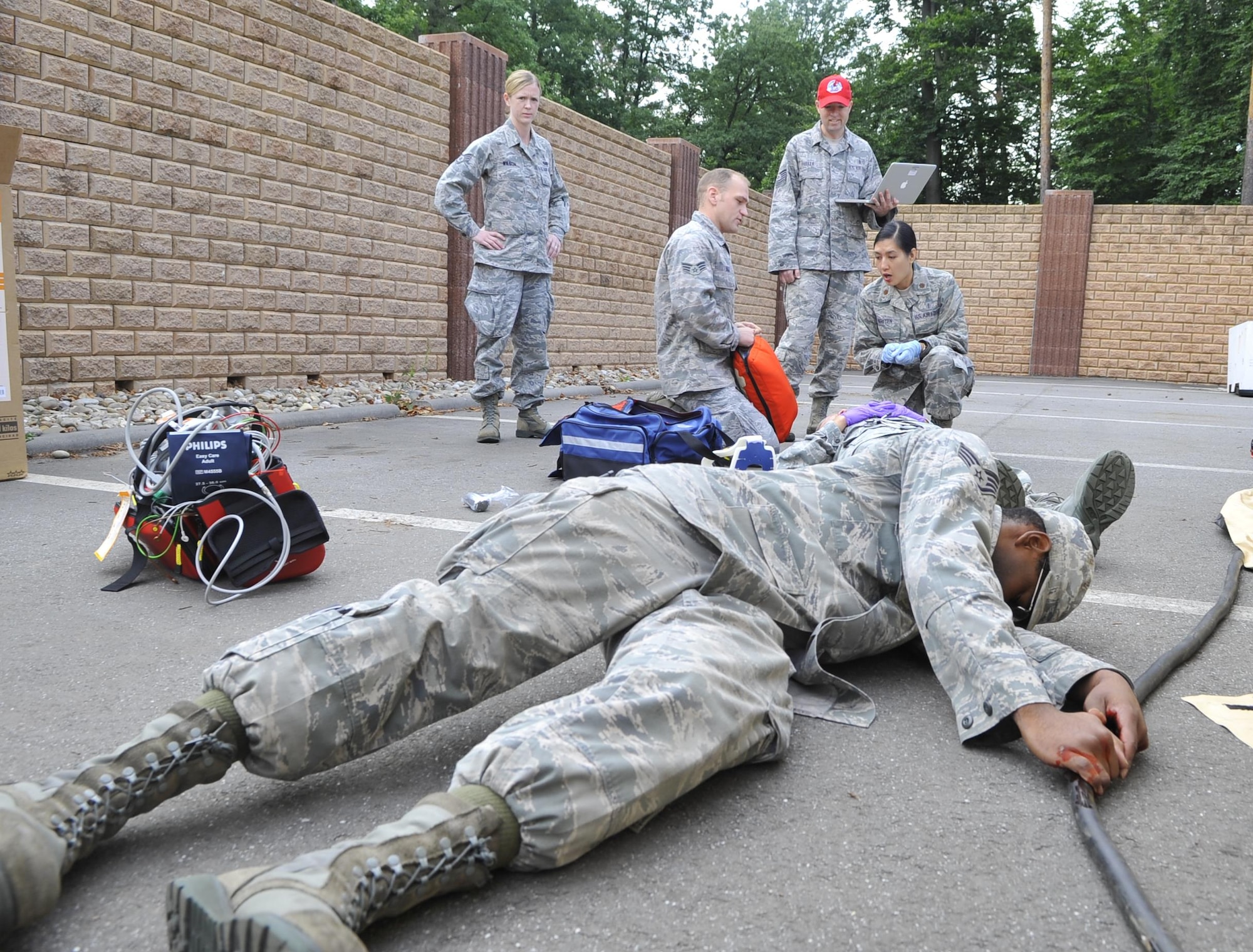 An U.S. Air Forces in Europe and Air Forces Africa medical unit member simulates being electrocuted during expeditionary medical support training Aug. 28, 2013, at Ramstein Air Base, Germany. EMEDS training is conducted to prepare Airmen for humanitarian missions. (U.S. Air Force photo/Airman Dymekre Allen)