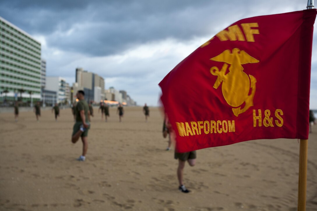 Col. Paul Ryan, commanding officer, Headquarters and Service Battalion, U.S. Marine Corps Forces Command, lead his Marines on a formation run along the Virginia Beach Boardwalk Sept. 6. According to Ryan, he wanted to increase the Marines' physical fitness while building unit morale and esprit de corps.