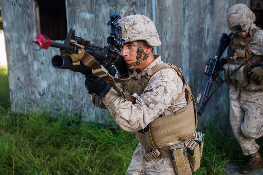U.S. Marine Corps Lance Cpl. Anthony Gardner, Battalion Landing Team 1st Battalion, 6th Marine Regiment, 22nd Marine Expeditionary Unit (MEU), point man and native of Statesboro, Ga., leads his team to a building during a raid on a simulated village as part of the MEU’s Realistic Urban Training exercise at Fort Pickett, Va., Sept. 2, 2013. The MEU is scheduled to deploy in early 2014 to the U.S. 5th and 6th Fleet areas of responsibility with the Bataan Amphibious Ready Group as a sea-based, expeditionary crisis response force capable of conducting amphibious missions across the full range of military operations. (U.S. Marine Corps photo by Sgt. Austin Hazard/Released)
