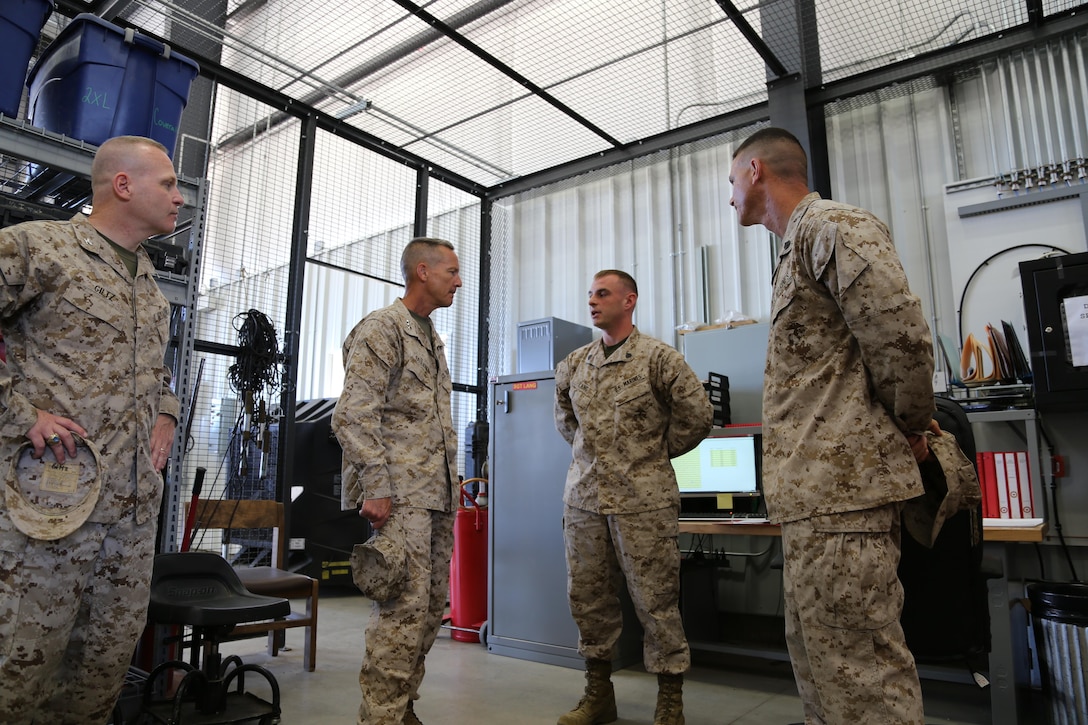 Lieutenant General William M. Faulkner, Deputy Commandant for Installations and Logistics, paid a very special visit to the Marines of Fort Leonard Wood. Sergeant Christopher D. Lang and Staff Sergeant Michael P. Foley answer questions about the Marine Corps Detachment Motor Transportation Maintenance aboard Fort Leonard Wood.  