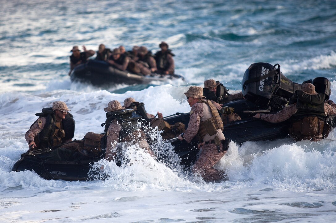 Marines with Alpha Company, Battalion Landing Team 1st Battalion, 4th Marine Regiment, 13th Marine Expeditionary Unit, make landing in F470 Zodiac Combat Rubber Raid Craft on Pyramid Rock Beach, Marine Corps Base Hawaii, Aug. 30, 2013. The boat company secured the beach, allowing follow-on forces to conduct an amphibious assault. The battalion is attached to the 13th MEU on a deployment to the Pacific. (U.S. Marine Corps photo by Cpl. Matthew Callahan)