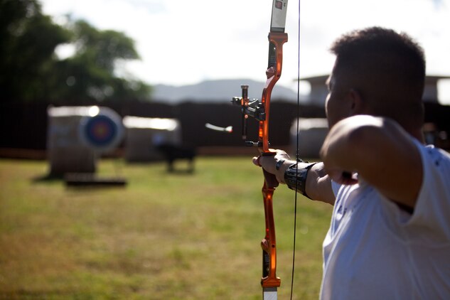 Capt. Chris McGleinnaiss with Wounded Warrior Battalion West-Detachment Hawaii shoots his bow at the Marine Corps Base Hawaii Archery Range Aug. 29, 2013 in preparation for the Marine Corps Trials. (U.S. Marine Corps photo by Lance Cpl. Suzanna Knotts)