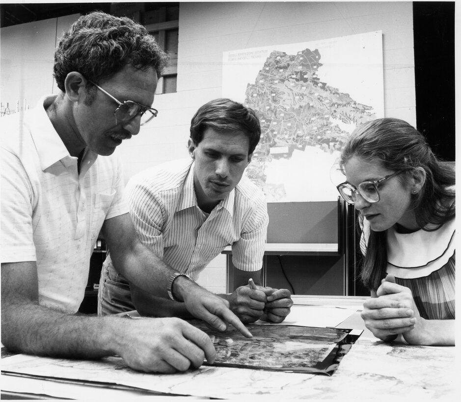 Construction Engineering Research Laboratory’s Bill Goran (left), along with Jim Westervelt and Marilyn Ruiz, works on an early GRASS map in the late 1980s.