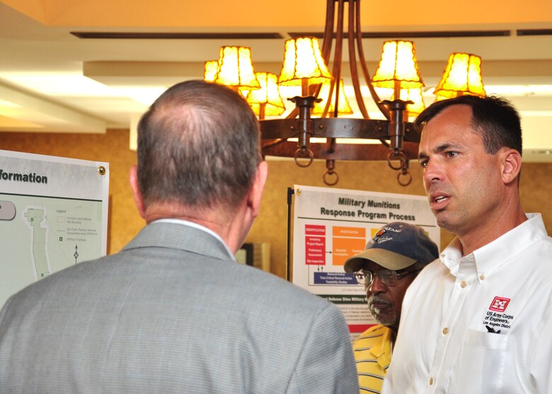 SIERRA VISTA, Ariz. -- Jesse Laurie, project manager in the U.S. Army Corps of Engineers Los Angeles District's Tucson Resident Office, speaks with members of the Sierra Vista, Ariz. community during a public meeting held Sept. 4. Laurie and other District team members were on hand with representatives from local and state agencies to discuss  the District's upcoming remedial investigation of Formerly Used Defense Sites within the San Pedro Riparian National Conservation Area