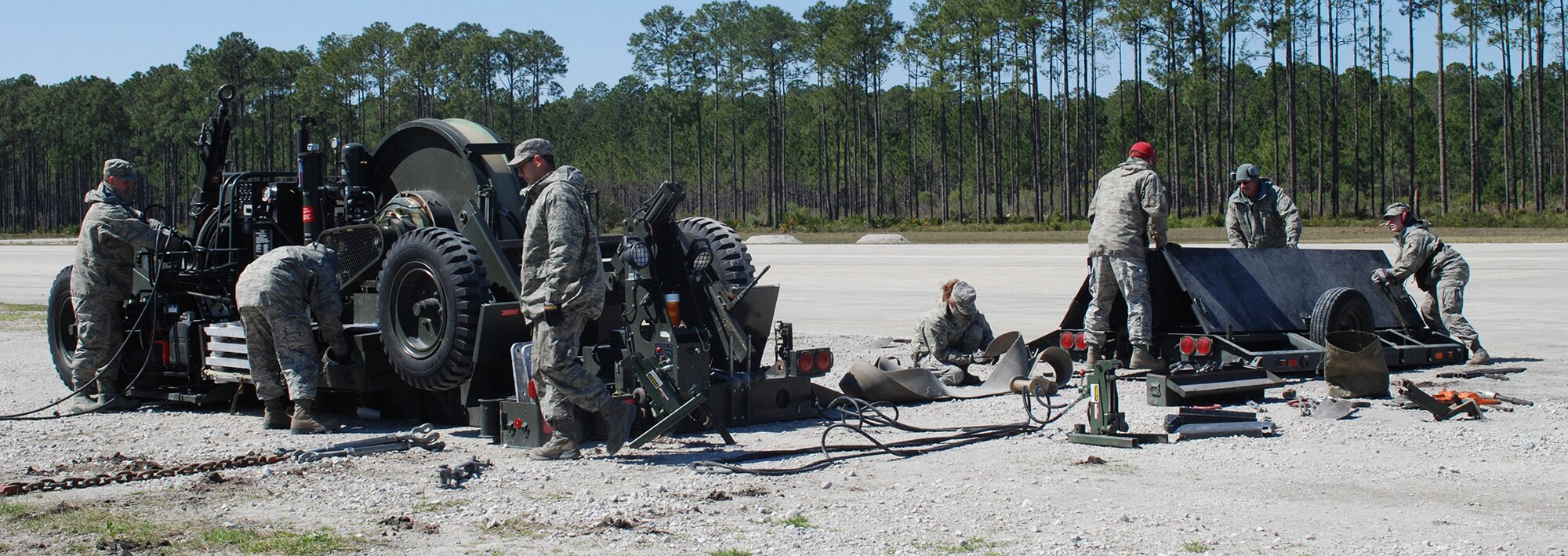 Civil engineers, under the supervision of Silver Flag cadre, assemble the Mobile Aircraft Arresting System at Silver Flag, Tyndall Air Force Base, Fla. Reserve civil engineers from the 446th Civil Engineer Squadron are headed to Florida this month for a variety of skills training at Silver Flag.  (U.S. Air Force photo by Maj. Frank Howard/Released)