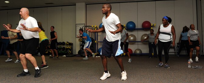 Insanity participants perform an exercise during the new Insanity class offered at the Dyess Fitness Center Aug. 27, 2013.. There are different modifications to accommodate those who are just starting out and those who have been at it for a while.(U.S. Air Force photo by Airman Autumn Velez/Released)