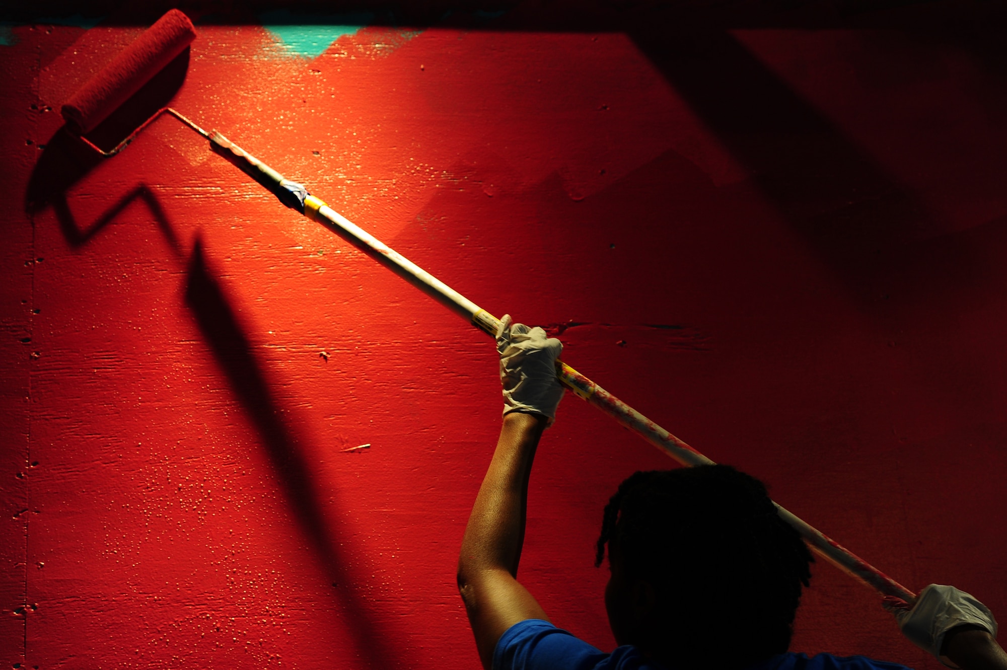 Master Sgt. Lakisha Embery, 315th Maintenance Squadron, Non-Destructive Inspections craftsman paints a wall during the Day of Caring event Sep. 6, 2013, at the Children's Museum of the Low Country in Charleston, S.C. Approximately 2,500 service members from JB Charleston participated in the Day of Caring, volunteering their skills to assist with more than 50 projects in the local community. The base held their volunteer events a week earlier than Trident United Way's Day of Caring, due to events surrounding the delivery of the final U.S. Air Force C-17 Globemaster III.   (U.S. Air Force photo/ Airman 1st Class Chacarra Neal)