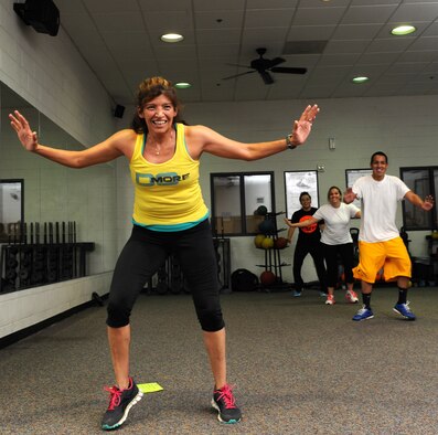 Penny Vieau, a Dyess Fitness Center Insanity instructor, teaches the new Insanity class at the Dyess Fitness Center Aug. 27, 2013. The Insanity class is a 30-minute workout session packed with maximum interval training.(U.S. Air Force photo by Airman Autumn Velez/Released)