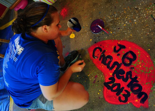 Staff Sgt. Stephanie Rowe, 628th Aerial Medical Squadron, dental assistant paints a floor during the Day of Caring event Sep. 6, 2013, at the Children's Museum of the Low Country in Charleston, S.C. Approximately 2,500 service members from JB Charleston participated in the Day of Caring, volunteering their skills to assist with more than 50 projects in the local community. The base held their volunteer events a week earlier than Trident United Way's Day of Caring, due to events surrounding the delivery of the final U.S. Air Force C-17 Globemaster III.   (U.S. Air Force photo/ Airman 1st Class Chacarra Neal)