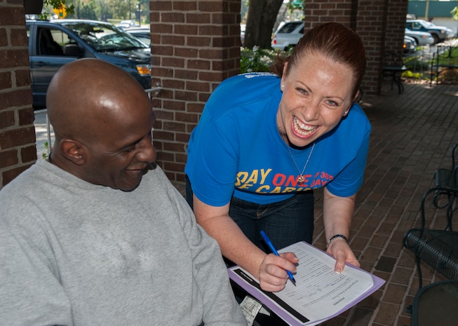Tech. Sgt. Jessica Dicicco, 628th Medical Logistics NCO in charge of Storage and Distribution, interviews Isaac Blake, U.S. Marine Corps veteran, during the Day of Caring September 6, 2013 at Mt. Pleasant Manor, Mt. Pleasant, S.C. Approximately 2,500 service members from JB Charleston participated in the Day of Caring, volunteering their skills to assist with more than 50 projects in the local community. The base held their volunteer events a week earlier than Trident United Way's Day of Caring, due to events surrounding the delivery of the final U.S. Air Force C-17 Globemaster III.  (U.S. Air Force photo/Senior Airman Ashlee Galloway)