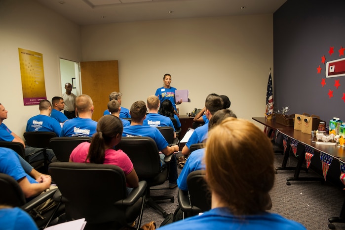 Dana Madanski, manager of volunteer services at Odyssey Hospice, briefs service members of Joint Base Charleston before they are sent out to interview veterans in the Tri-County area September 6, 2013 in North Charleston, S.C. Approximately 2,500 service members from JB Charleston participated in the Day of Caring, volunteering their skills to assist with more than 50 projects in the local community. The base held their volunteer events a week earlier than Trident United Way's Day of Caring, due to events surrounding the delivery of the final U.S. Air Force C-17 Globemaster III.  (U.S. Air Force photo/Senior Airman Ashlee Galloway)