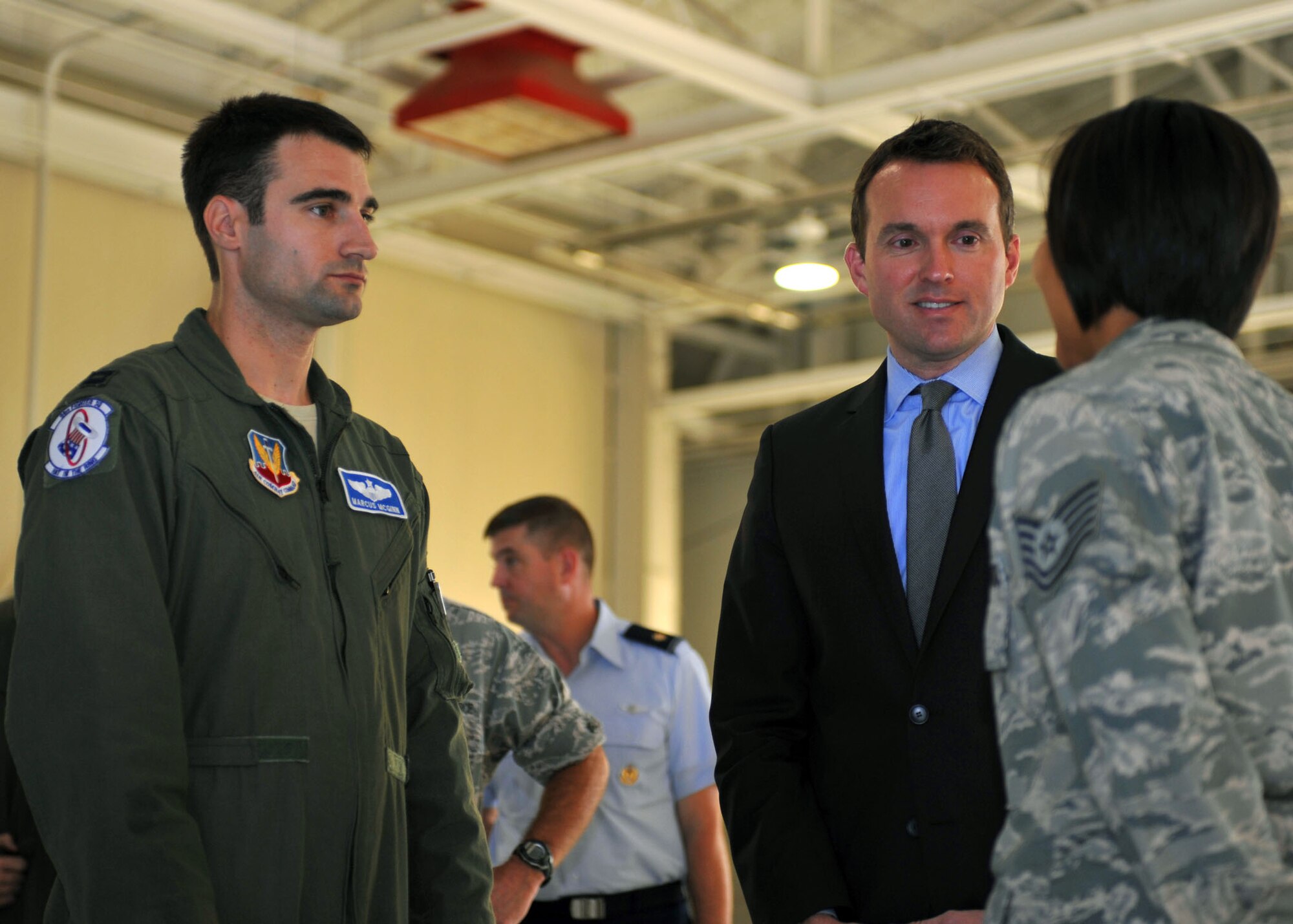 Acting Secretary of the Air Force Eric K. Fanning meets with Tech. Sgt. Teresa Chavez, 1st Maintenance Squadron low observable aircraft structural maintenance craftsman, right, and Capt. Marcus McGinn, 94th Fighter Squadron chief of weapons, left, during a visit to Langley Air Force Base, Va., Sept. 5, 2013. Fanning toured the 94th Fighter Squadron, the 497th Intelligence, Surveillance and Reconnaissance Wing, and the Air Force Targeting Center. Additionally, Fanning spoke to Langley Airmen about current Air Force issues, including sequestration, sexual assault prevention and force shaping. (U.S. Air Force photo by Staff Sgt. Katie Gar Ward/Released)
