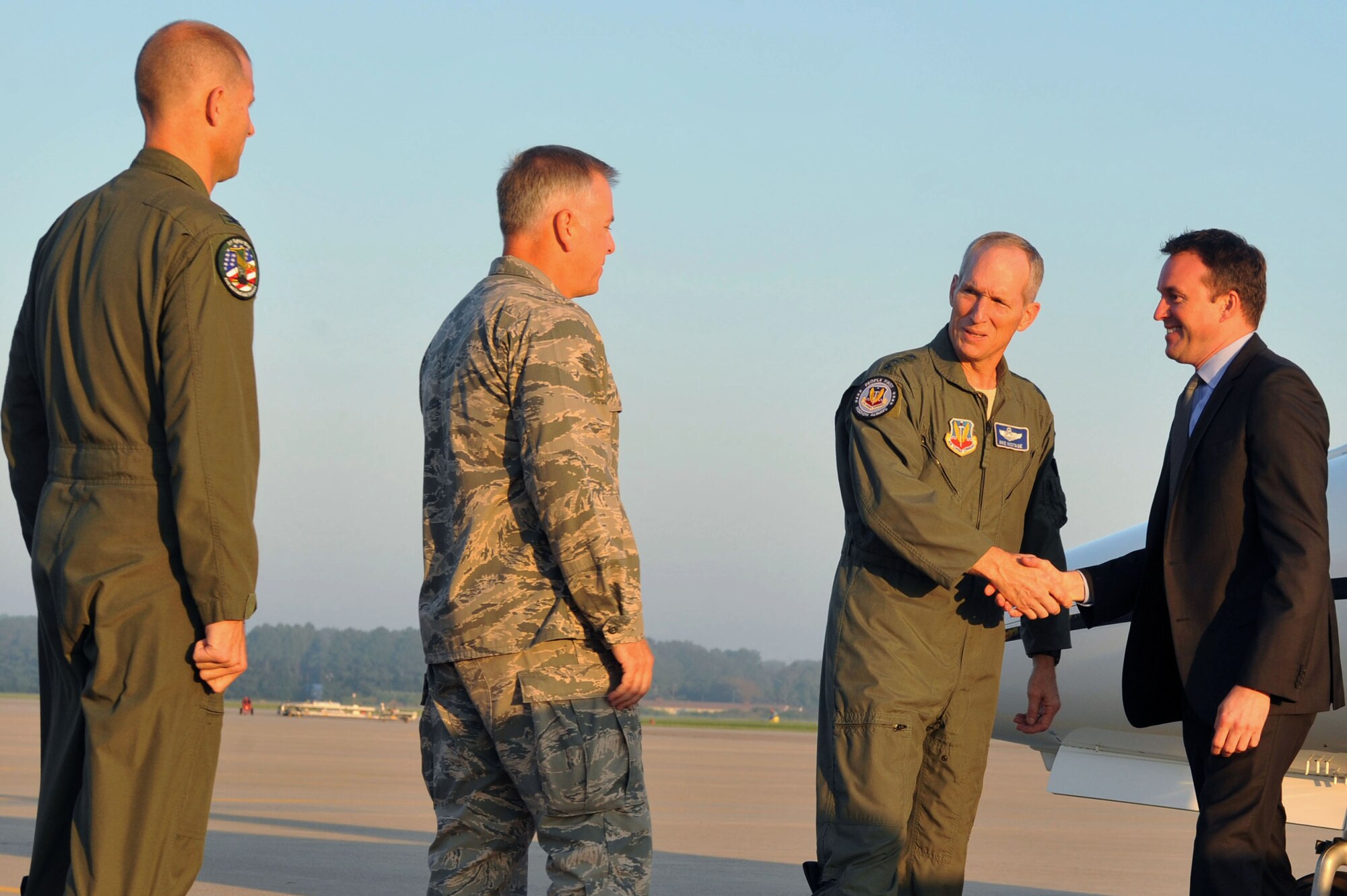 Acting Secretary of the Air Force Eric K. Fanning is greeted upon arrival by, from right, Gen. Mike Hostage, Air Combat Command commander, Col. John Allen, 633rd Air Base Wing commander and Col. Kevin Huyck, 1st Fighter Wing commander, during a visit to Langley Air Force Base, Va., Sept. 5, 2013. Fanning toured the 94th Fighter Squadron, the 497th Intelligence, Surveillance and Reconnaissance Wing, and the Air Force Targeting Center. Additionally, Fanning spoke to Langley Airmen about current Air Force issues, including sequestration, sexual assault prevention and force shaping. (U.S. Air Force photo by Staff Sgt. Katie Gar Ward/Released)
