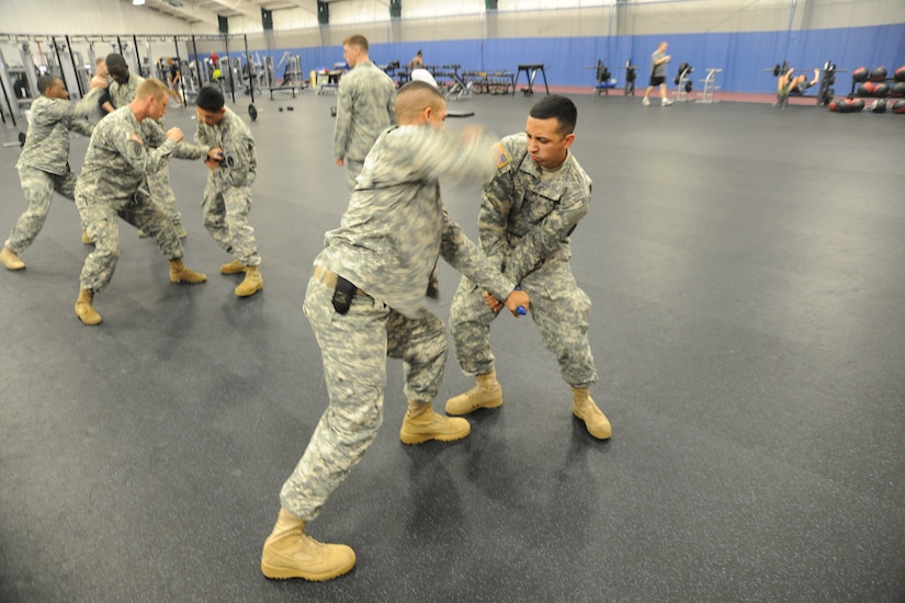 U.S. Army Soldiers practice combative techniques and weapons takeaway procedures during their Fly Away Security Team course at Joint Base Andrews, Md., Sept. 4. (U.S. Air Force Photo/Airman 1st Class Joshua R. M. Dewberry)