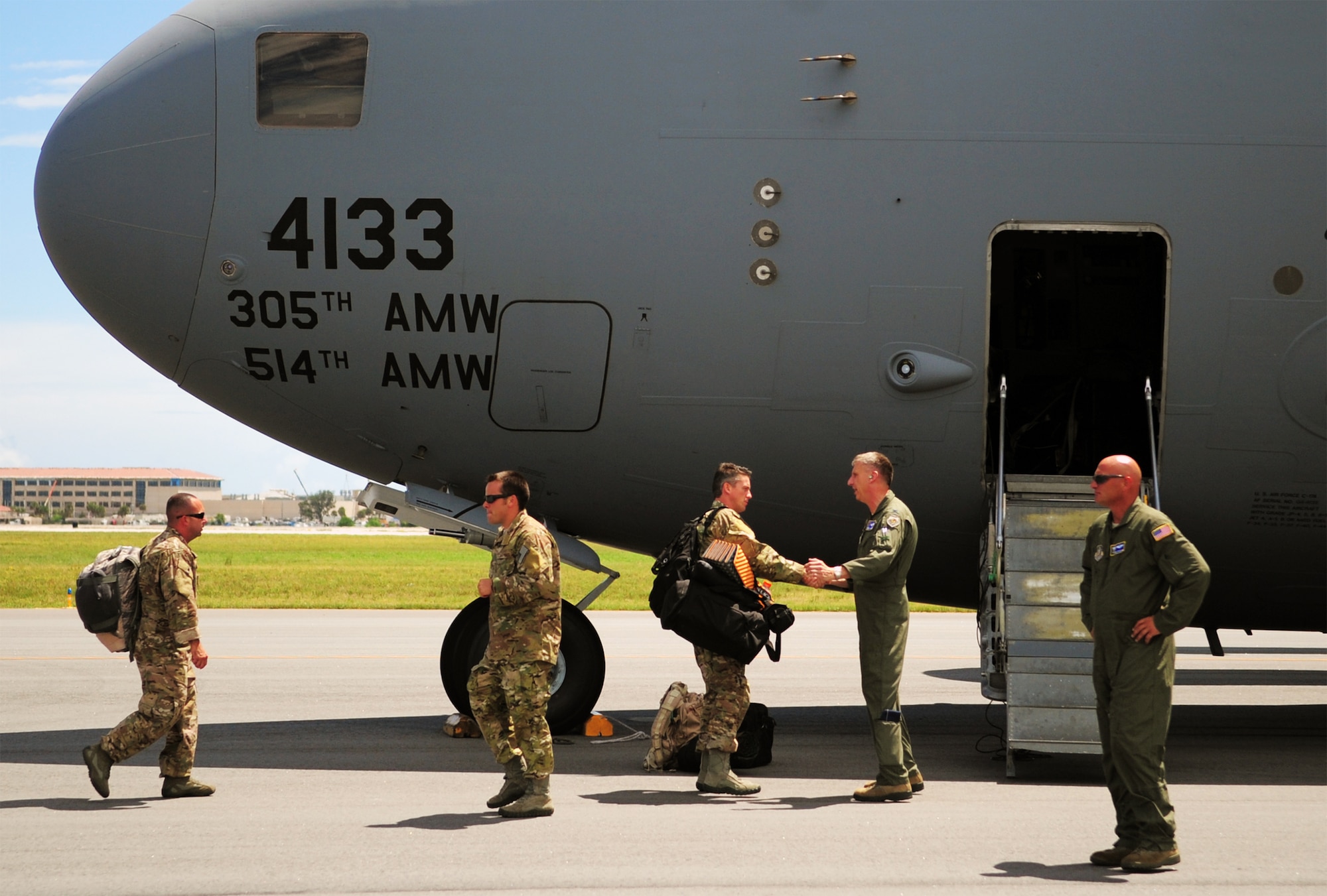 PATRICK AIR FORCE BASE, Fla. -- A group of reservists from the 920th Rescue Wing here deploy to the Horn of Africa Sept. 5 for contingency support there. Approximately 20 pararescuemen and various support personnel from the 920th deployed in a C-17 Globemaster from the 514th Air Mobility Wing at Joint Base McGuire-Dix-Lakenhurst, N.J. The PJs will serve as part of the Combined Joint Task Force-Horn of Africa and will be in place for personnel-recovery operations along with humanitarian efforts as needed. The deployment comes as one of many for Airmen of the 920th RQW. Roughly 40 Rescue Wing Airmen are currently deployed to Southeast Asia providing life-saving medical evacuations of combatants wounded on the battlefield. Seen here, wing commander Col. Jeffrey Macrander sees his Airmen off as they depart. Air Force pararescuemen are specifically organized, trained and equipped to conduct personnel recovery operations in hostile or denied areas as a primary mission. (U.S. Air Force photo/Master Sgt. Paul Flipse)
