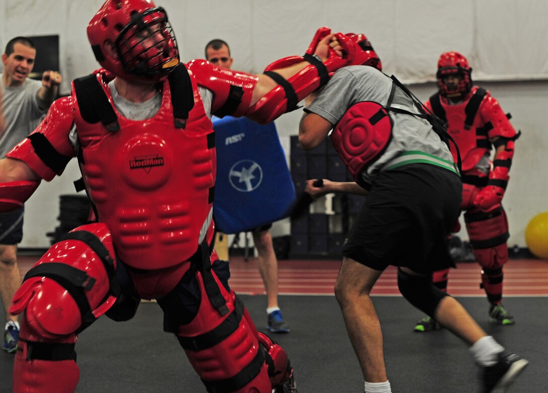 U.S. Army service members receive padded combat training from U.S. Air Force Security Forces ravens during a Fly Away Security Team course on Joint Base Andrews, Md., Aug. 28, 2013. The course was designed to better the Soldiers expertise on maintaining aircraft security. The Soldiers are assigned to the United States Army Priority Air Transport units around the National Capitol Region. The ravens are assigned to the 811th Security Forces Squadron. (U.S. Air Force photo/Airman 1st Class Erin O’Shea)