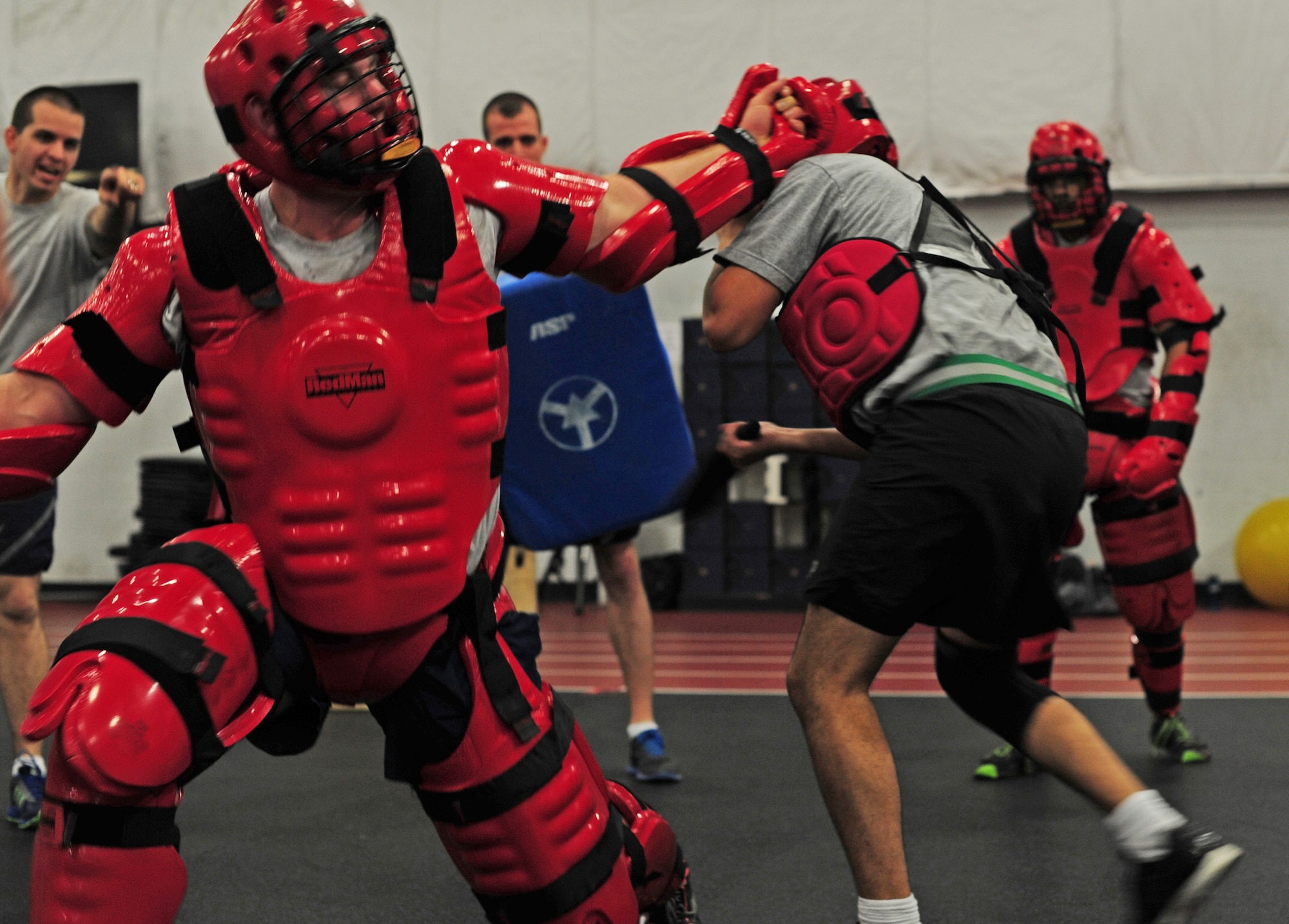 U.S. Army service members receive padded combat training from U.S. Air Force Security Forces ravens during a Fly Away Security Team course on Joint Base Andrews, Md., Aug. 28, 2013. The course was designed to better the Soldiers expertise on maintaining aircraft security. The Soldiers are assigned to the United States Army Priority Air Transport units around the National Capitol Region. The ravens are assigned to the 811th Security Forces Squadron. (U.S. Air Force photo/Airman 1st Class Erin O’Shea)