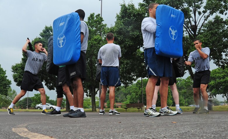 U.S. Army service members receive baton training from U.S. Air Force Security Forces ravens during a Fly Away Security Team course on Joint Base Andrews, Md., Aug. 28, 2013. The course was designed to better the Soldiers' expertise on maintaining aircraft security. The Soldiers are assigned to United States Army Priority Air Transport units around the National Capitol Region. The ravens are assigned to the 811th Security Forces Squadron. (U.S. Air Force photo/Airman 1st Class Erin O’Shea)