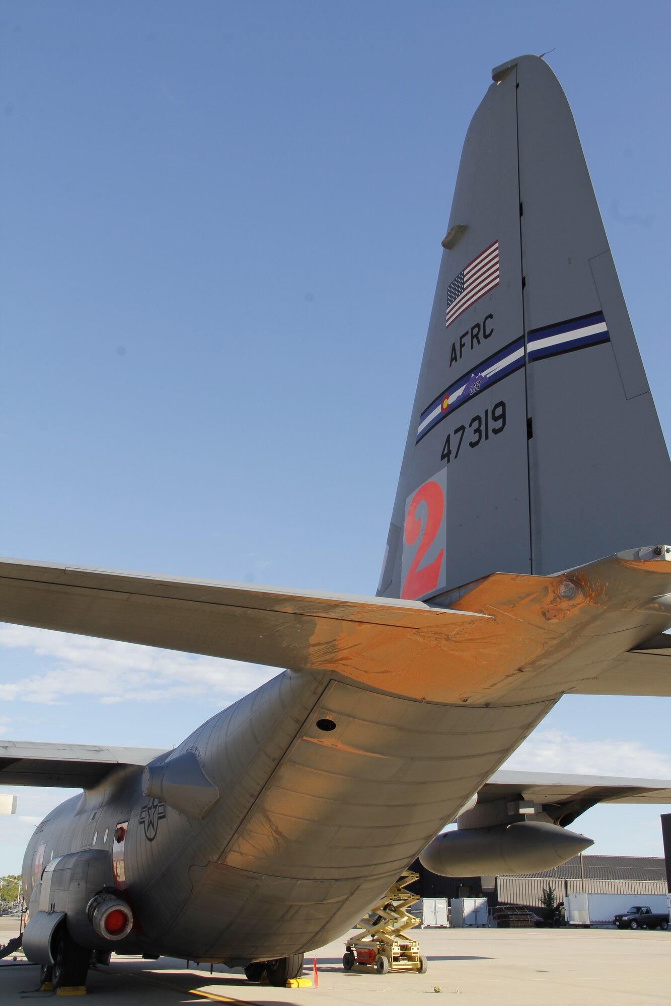 With remnants of Phos-Chek retardant beneath its tail section, MAFFS 2 from the Air Force Reserve Command's 302nd Airlift Wing returned to home station at Peterson Air Force Base, Colo. Aug. 30, 2013 after providing aerial fire fighting support in the western U.S. MAFFS equipped C-130s, to include the 302nd AW's MAFFS 2 and MAFFS 5 have flown a total of 576 sorties making 541 drops using 1,387,881 gallons of retardant on fires in eight states from June 11 through Sep. 5. 