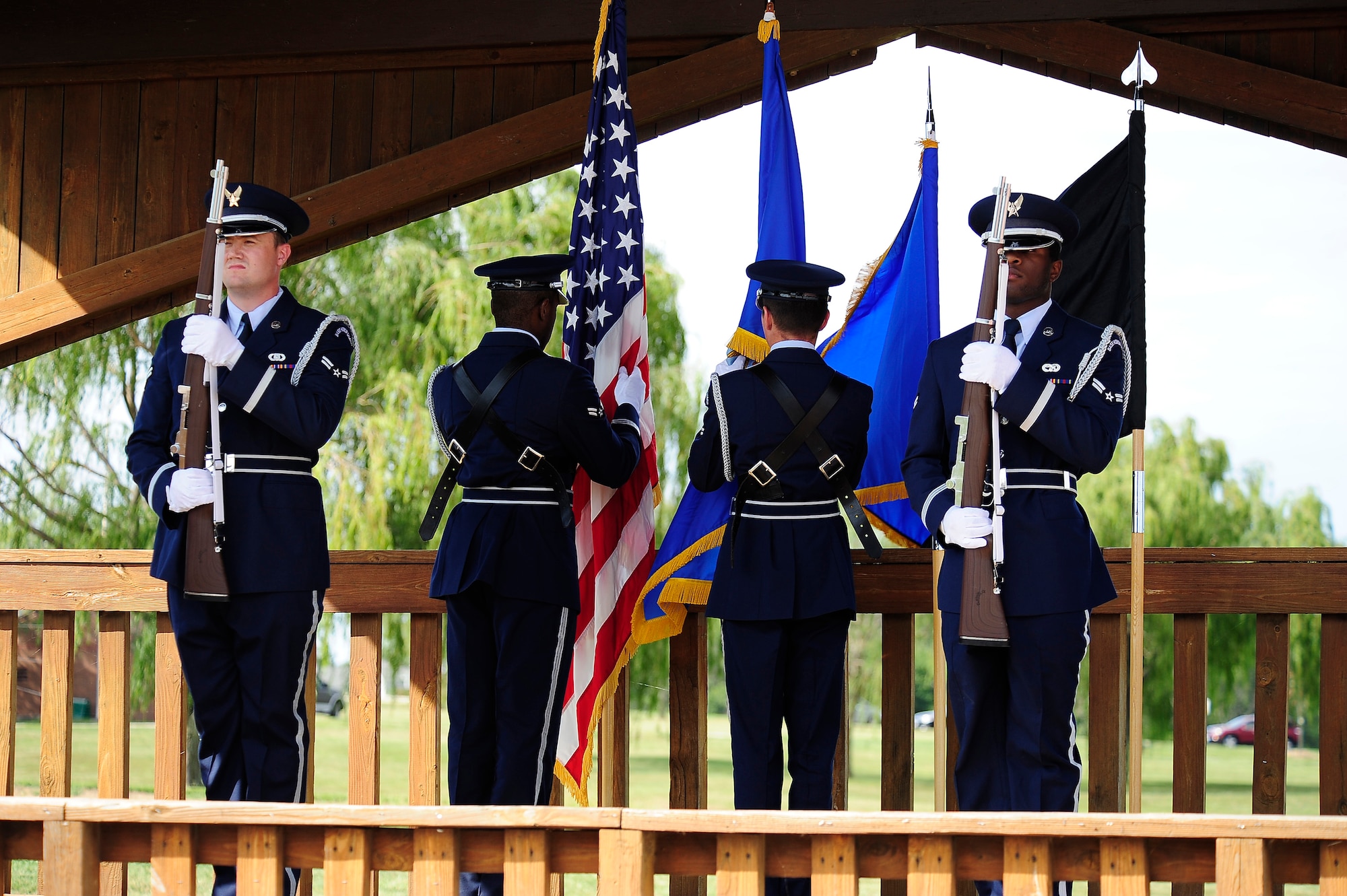 The Whiteman Honor Guard presents the colors during a POW/MIA remembrance ceremony Sept. 5, 2013, at Whiteman Air Force Base, Mo. According to the Defense Prisoner of War/ Missing Personnel Office, more than 83,000 Americans are still missing from World War II, the Korean War, the Cold War, the Vietnam War and the 1991 Gulf War. (U.S. Air Force photo by Staff Sgt. Brigitte N. Brantley/Released)