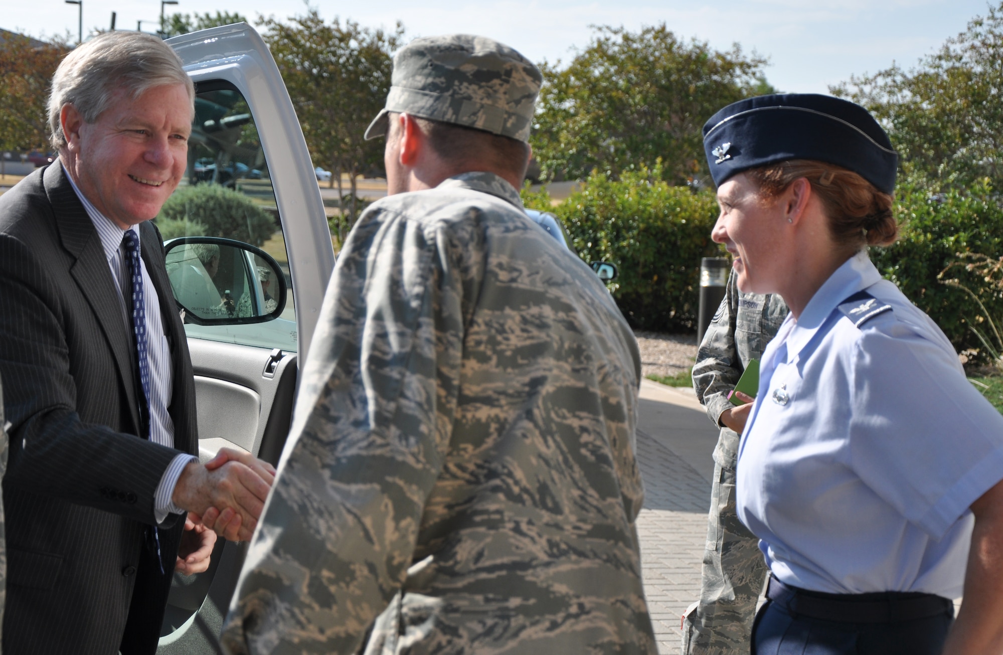 GOODFELLOW AIR FORCE BASE, Texas – Col. Kimberlee Joos, 17th Training Wing Commander, and Col. Thomas Schmidt, 17th TRW Vice Commander, welcome John Steen, Texas Secretary of State, to Goodfellow at the Norma Brown Building Sept. 4. Steen visited the base to talk to senior leaders and voting assistance officers and raise awareness for errors making absentee ballots invalid. (U.S. Air Force photo/ Airman 1st Class Joshua Edwards)