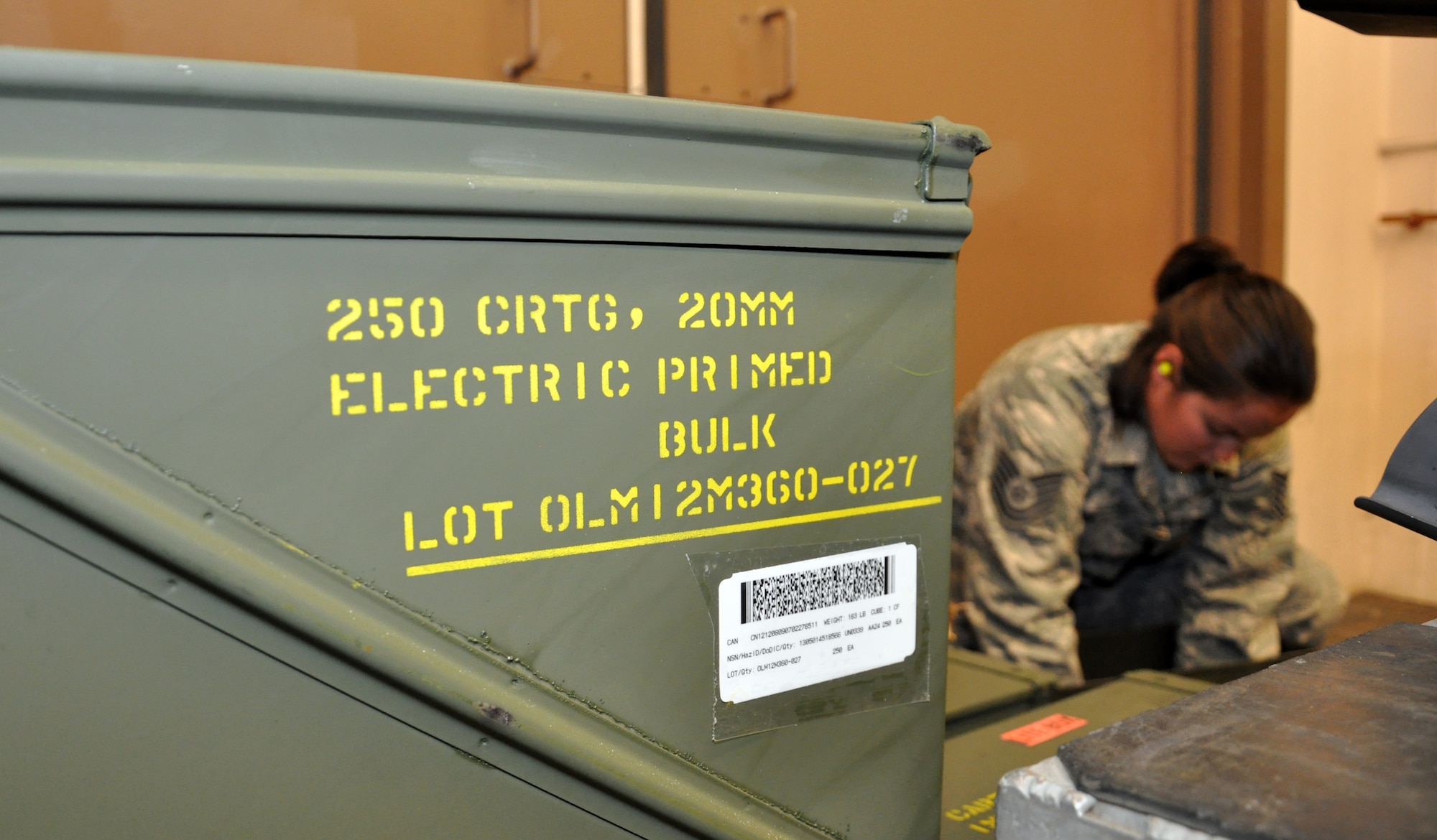 Tech. Sgt. Shaunna Reed, 140th Wing conventional maintenance crew chief, inspects ammunition before it is loaded into the Universal Ammunition Loading System Aug. 1, 2013, on Buckley Air Force Base, Colo.  The UALS hold 1,525 rounds of 20mm ammunition used by F-16 Fighting Falcons. The 140th Wing handles the munitions needs of units across the Front Range. (U.S. Air Force photo by Staff Sgt. Nicholas Rau/Released)