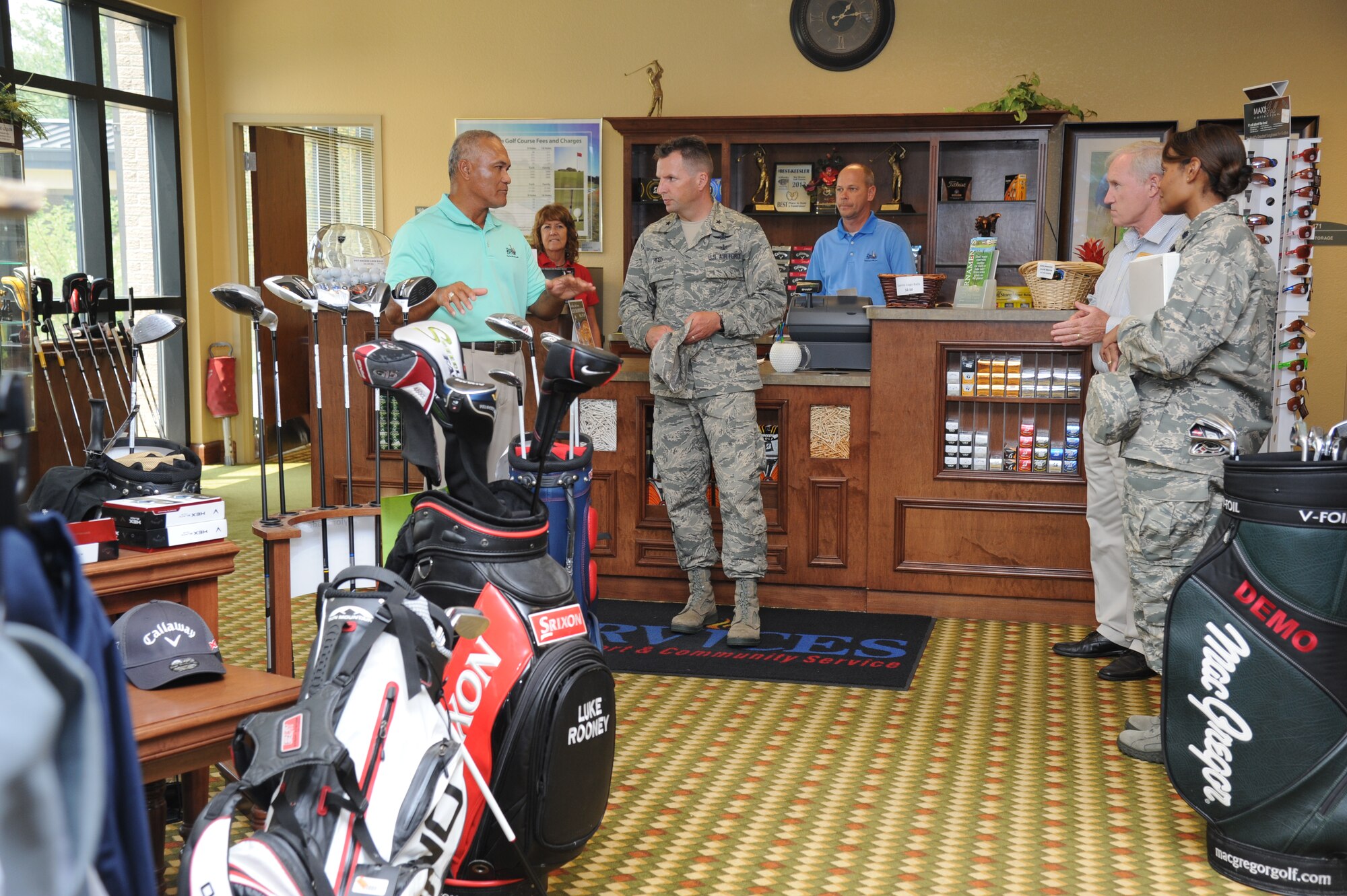 Tamalii Manu, 81st Force Support Squadron golf pro, gives a tour of the golf pro shop to Brig. Gen. Patrick Higby, 81st Training Wing commander, during an immersion tour of the 81st Mission Support Group Sept. 4, 2013, at the Bay Breeze Event Center, Keesler Air Force Base, Miss. The purpose of the tour was to learn the integration of the group operations and personnel.  (U.S. Air Force photo by Kemberly Groue)