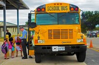 William Woodland, Randolph elementary school associate principle, ensures the children get on the right bus Aug. 27 in front of the elementary school at Joint Base San Antonio-Randolph. (U.S. Air Force photo by Airman 1st Class Kenna Jackson)
