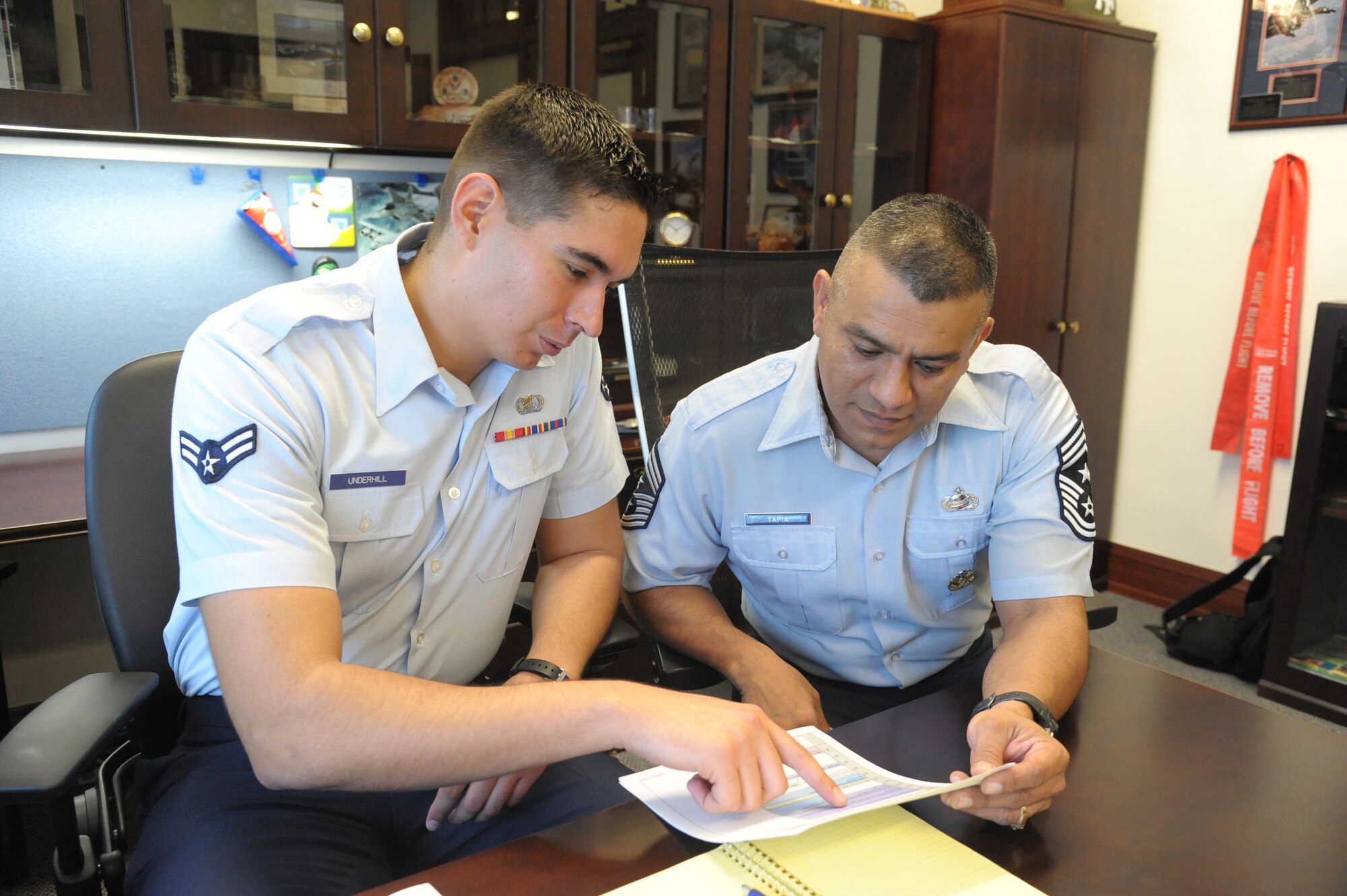 Chief Master Sgt. Gerardo Tapia, Air Education and Training Command command chief, mentors Airman 1st Class William Underhill, 902nd Contracting Squadron, Aug. 29 at Joint Base San Antonio-Randolph. (U.S. Air Force photo by Joel Martinez)

