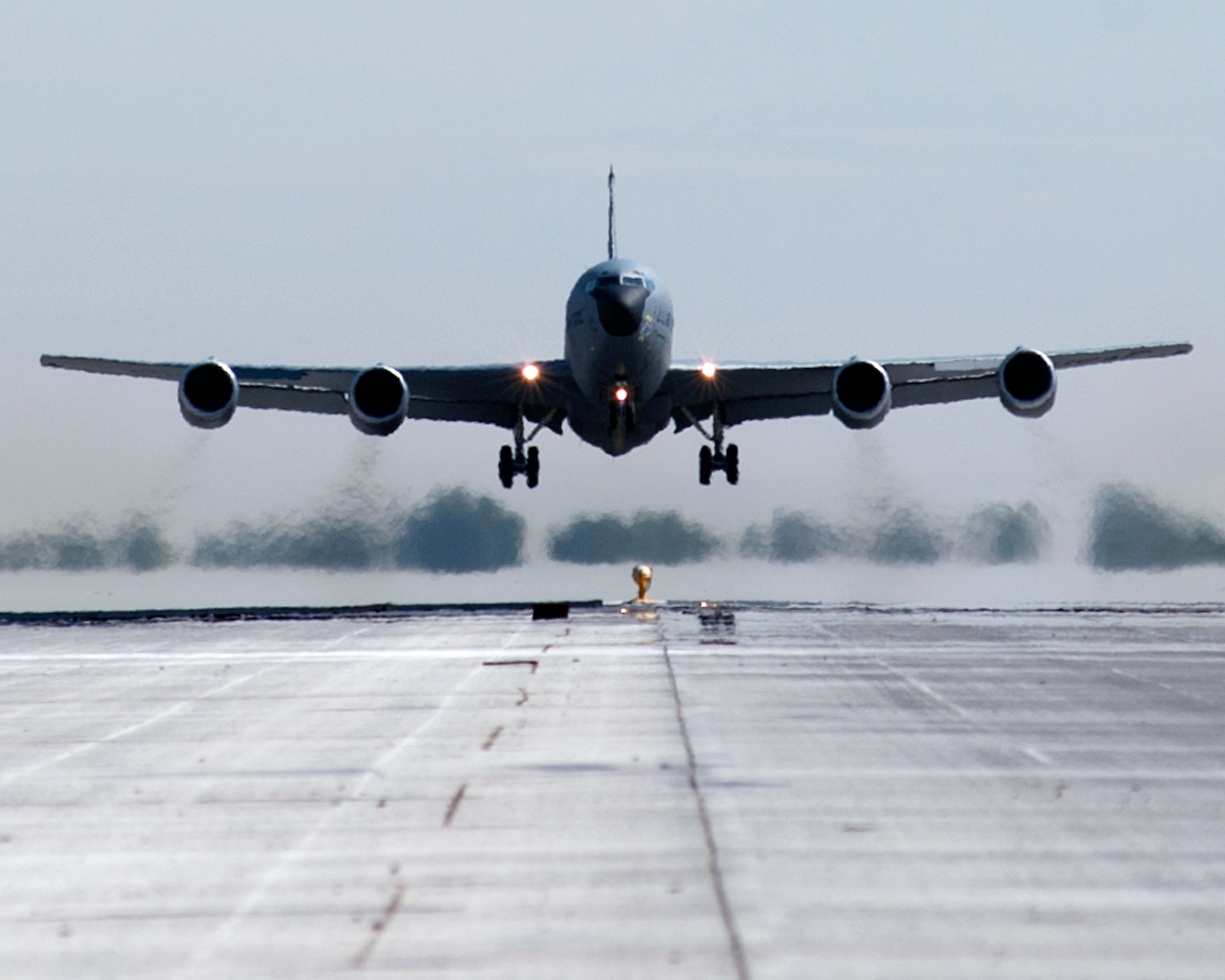 A KC-135 Stratotanker takes off for a mission at Transit Center at Manas, Kyrgyzstan, September 6, 2013. The KC-135's engines consist of four Pratt & Whitney TF-33 fan-jet engines, each weighing 6,100 pounds, and capable of developing 18,000 pounds of thrust. At 60 degrees Fahrenheit and full throttle, each engine consumes 10,250,000 cubic feet of air per hour, the equivalent of the air contained in a building 300 feet long, 100 feet wide and 34 stories tall. (U.S. Air Force photo/Staff Sgt. Robert Barnett)