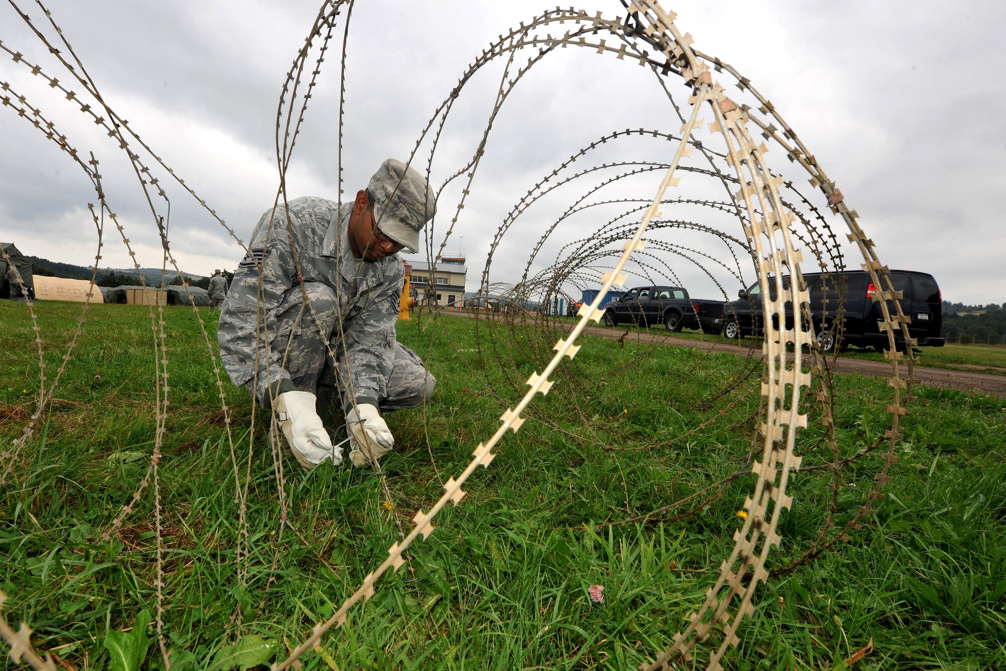 Staff Sgt. Kenneth Hawkins, 1st Air and Space Communications Squadron client system technician, secures the area around a communication control point during Exercise Market Orchard, Aug. 27, 2013, U.S. Army Garrison Baumholder, Germany. (U.S. Air Force photo/Senior Airman Chris Willis)