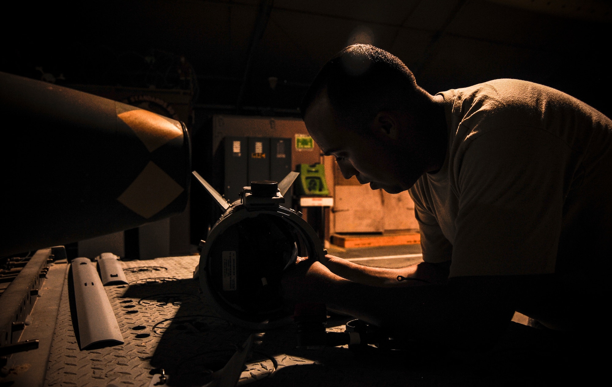Senior Airman Jesse Bermudez prepares the fin on a laser joint directed attack munition during a bomb build at the 379th Air Expeditionary Wing in Southwest Asia, Sept. 2, 2013. Bermudez is a 379th Expeditionary Maintenance Squadron conventional maintenance crew member deployed from Dyess Air Force Base, Texas, and a San Antonio native. (U.S. Air Force photo/Senior Airman Bahja J. Jones) 