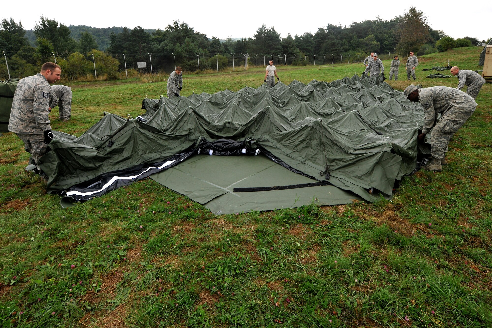 Airmen from the 435th Contingency Readiness Group set up an operational air base, Aug. 27, 2013, U.S. Army Garrison Baumholder, Germany.The exercise scenario challenged members to set up an operational air base that could provide humanitarian relief.  (U.S. Air Force photo/Senior Airman Chris Willis)