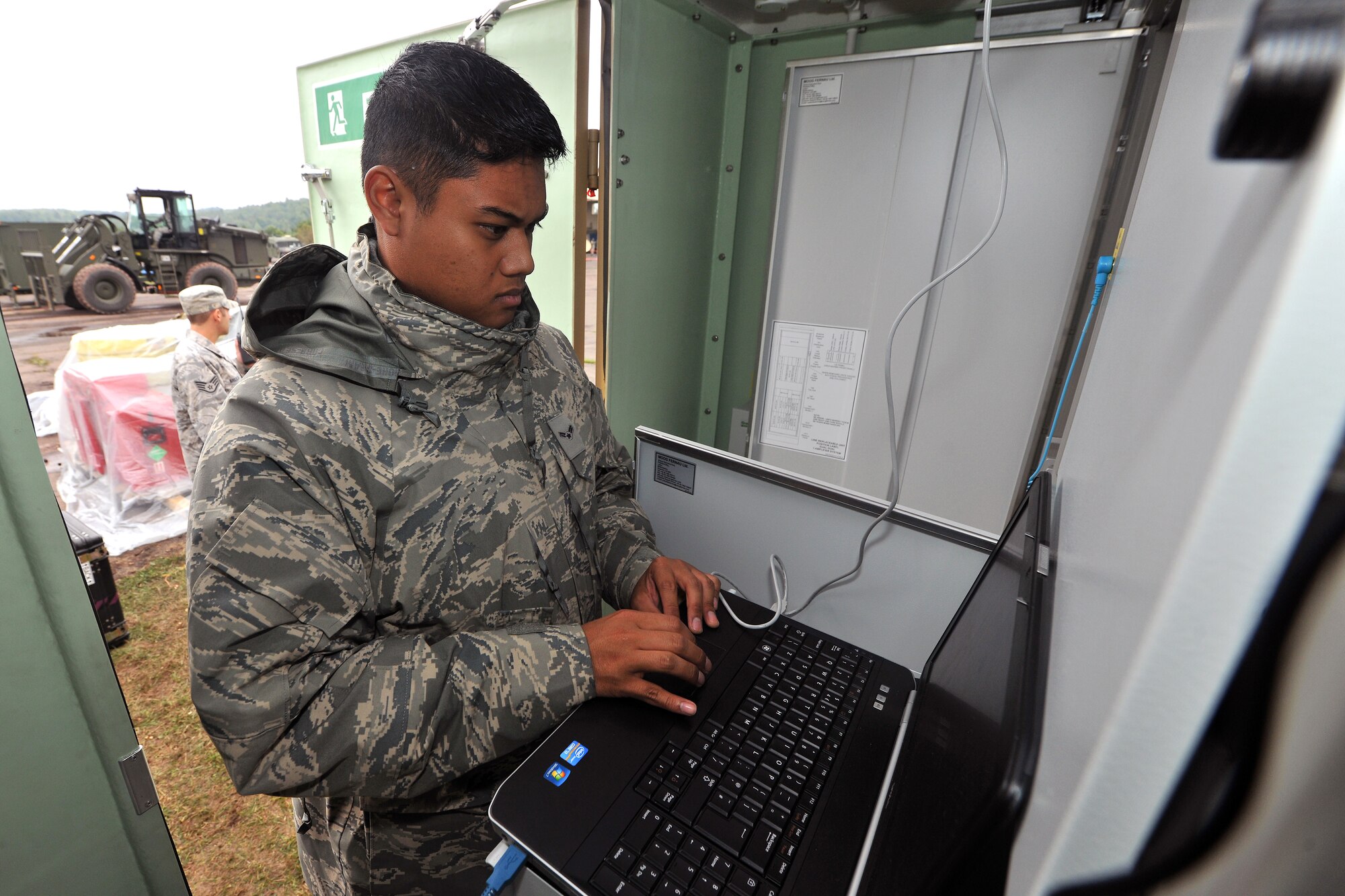 Airman 1st Class James Bautua, 1st Combat Communication Squadron airfield system technician, checks the power input on a tactical air navigation system during Exercise Market Orchard, Aug. 27, 2013, U.S. Army Garrison Baumholder, Germany. (U.S. Air Force photo/Senior Airman Chris Willis)