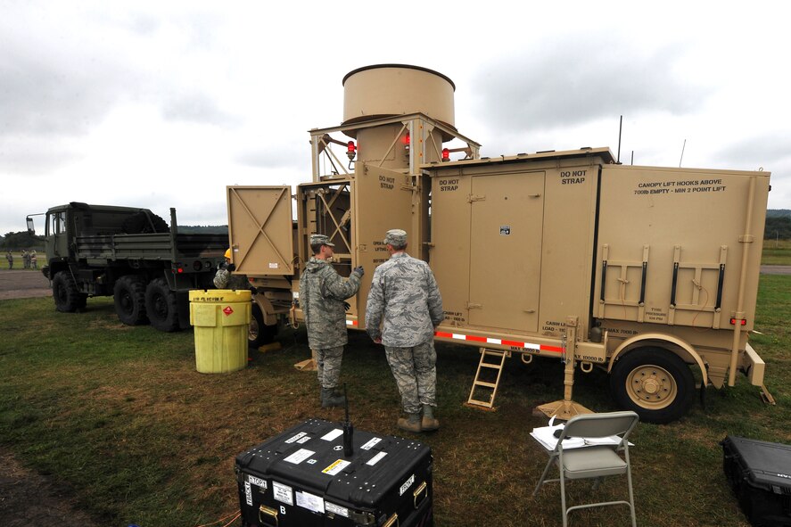 Airmen from the 1st Combat Communications Squadron raise the antenna on a tactical air navigation system during Exercise Market Orchard, Aug. 27, 2013, U.S. Army Garrison Baumholder, Germany.  (U.S. Air Force photo/Senior Airman Chris Willis)