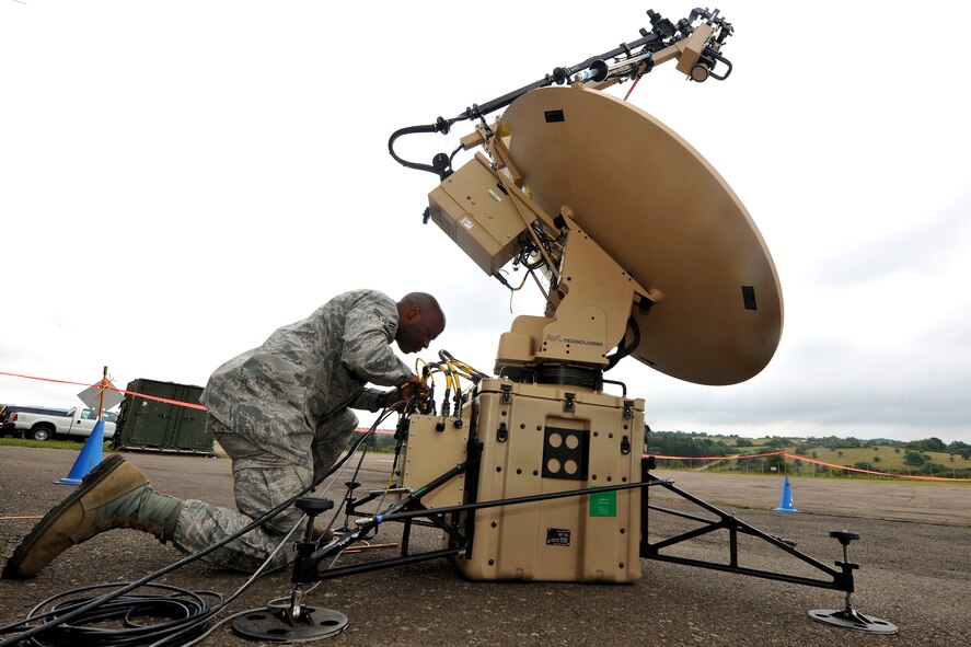 Airman 1st Class Malcolm Perry, 1st Combat Communications Squadron network technician, checks the cable connection to a mobile satellite unit during Exercise Market Orchard, Aug. 27, 2013, U.S. Army Garrison Baumholder, Germany.  (U.S. Air Force photo/Senior Airman Chris Willis)