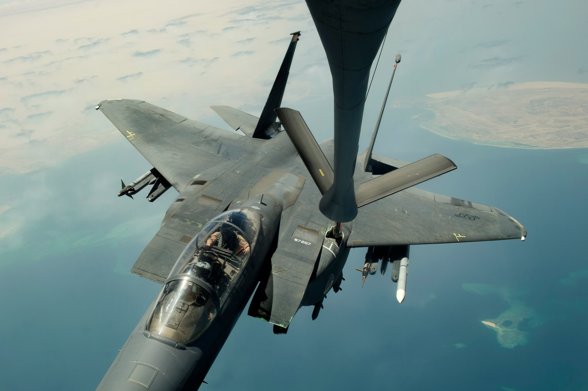 An F-15E Strike Eagle deployed from Mountain Home Air Force Base, Idaho, receives fuel from a KC-135R Stratotanker during a mission over the Persian Gulf, Aug. 30, 2013. (U.S. Air Force Photo/Master Sgt. Ben Bloker)
