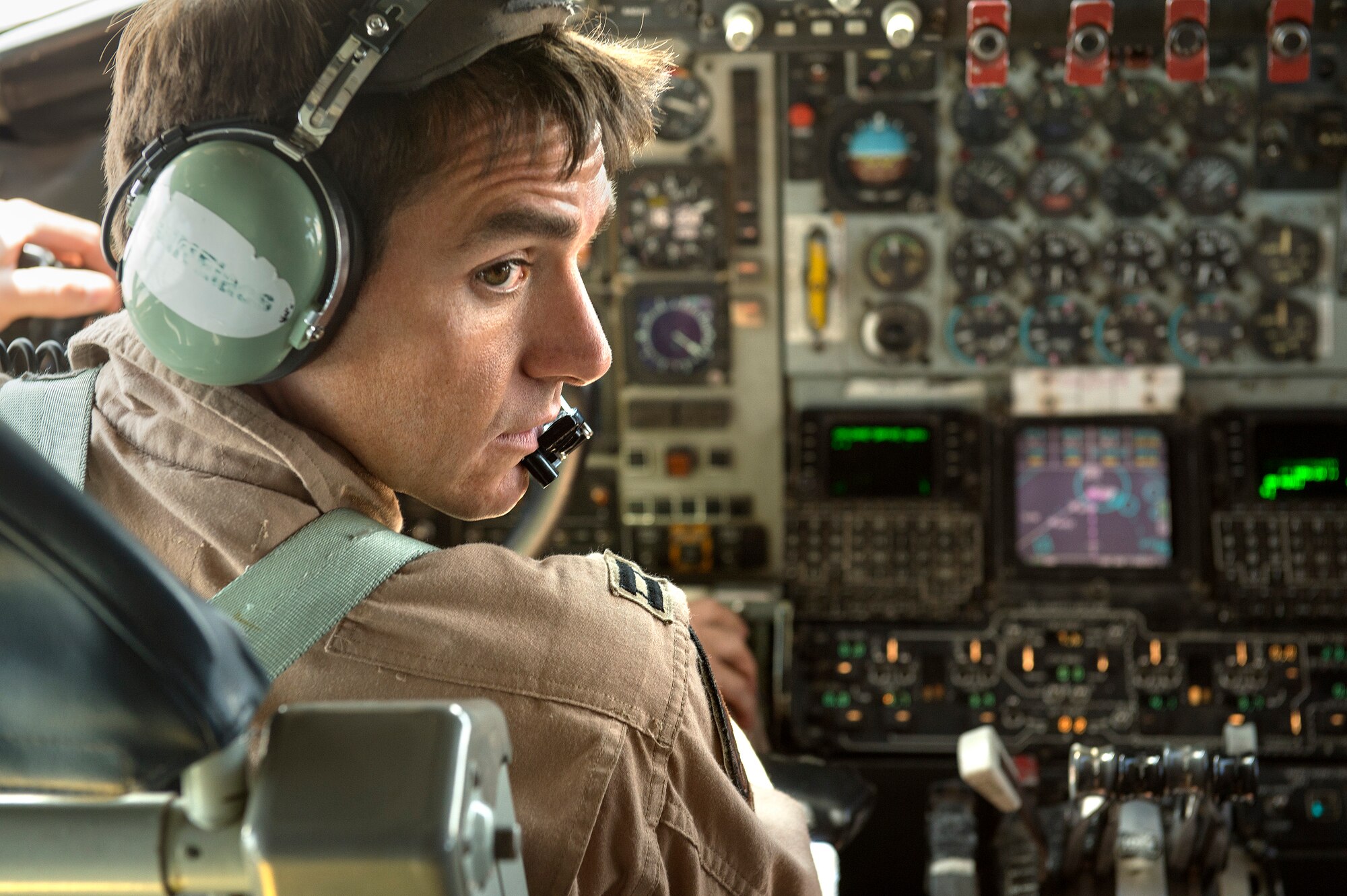 Capt. Andy Alfiero, 340th Expeditionary Air Refueling Squadron KC-135 pilot, communicates with crew members during a refueling mission over the Persian Gulf, Aug. 30, 2013. Alfiero, hailing from Portland, Maine, is deployed from Maine Air National Guard. (U.S. Air Force Photo/Master Sgt. Ben Bloker)
